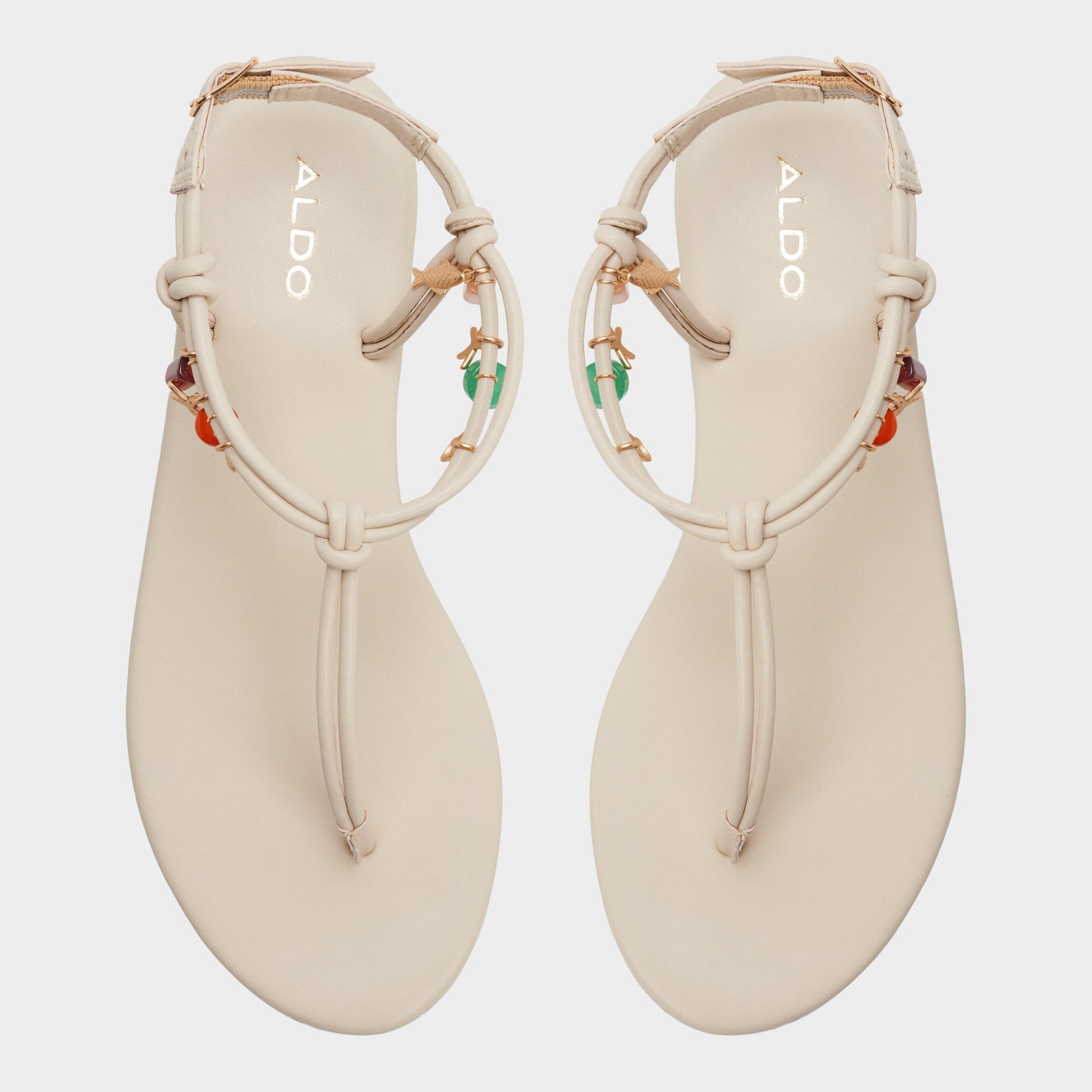 Top-down view of the White/bone Seajewels T-strap sandal