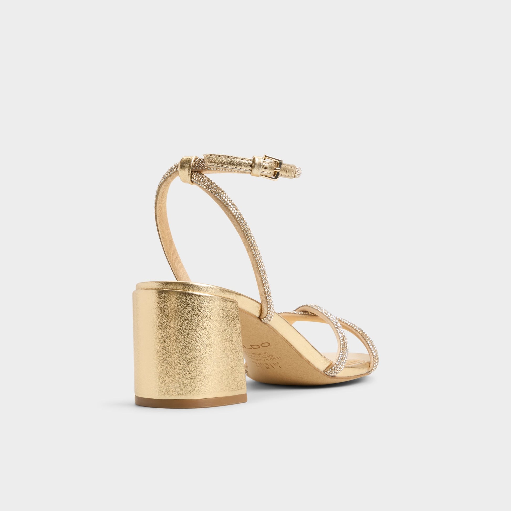 Three-quarter angle of Gold Boucliette Strappy heeled sandal's back side