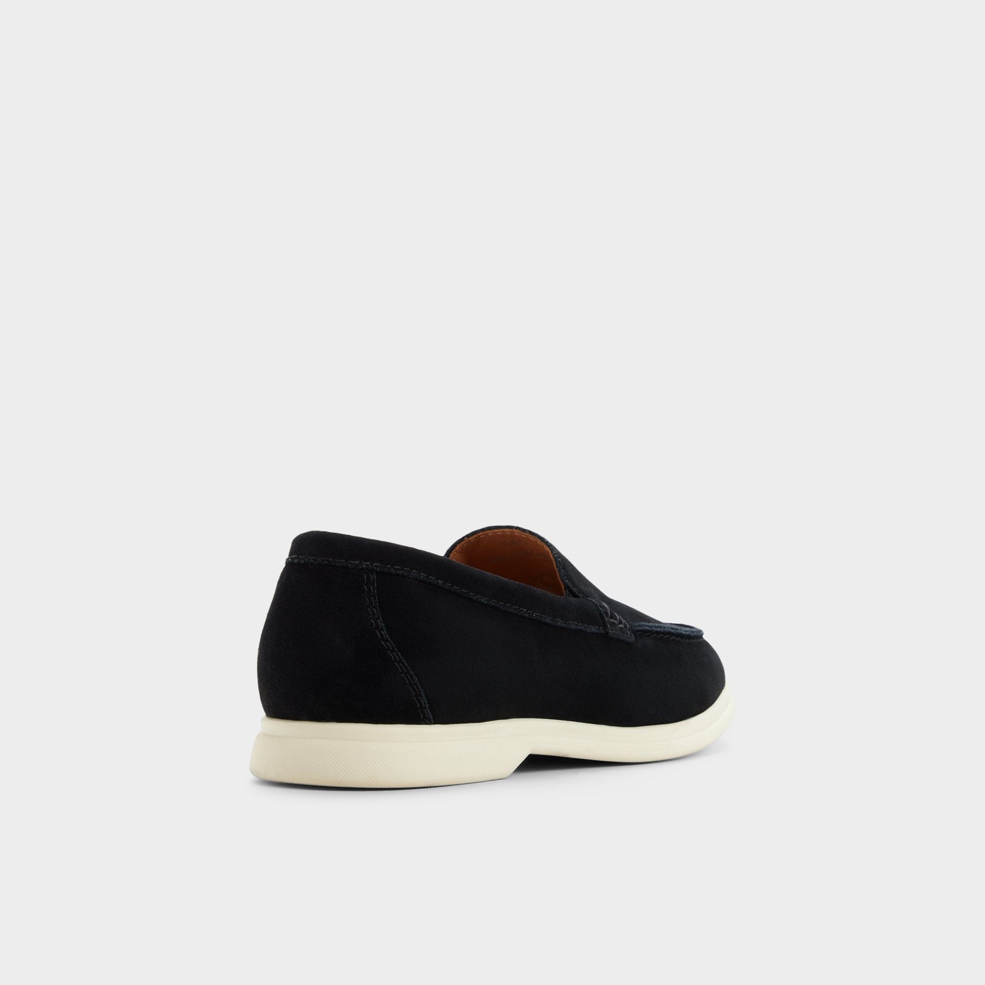 Three-quarter angle of Black Dolan Slip-on's back side