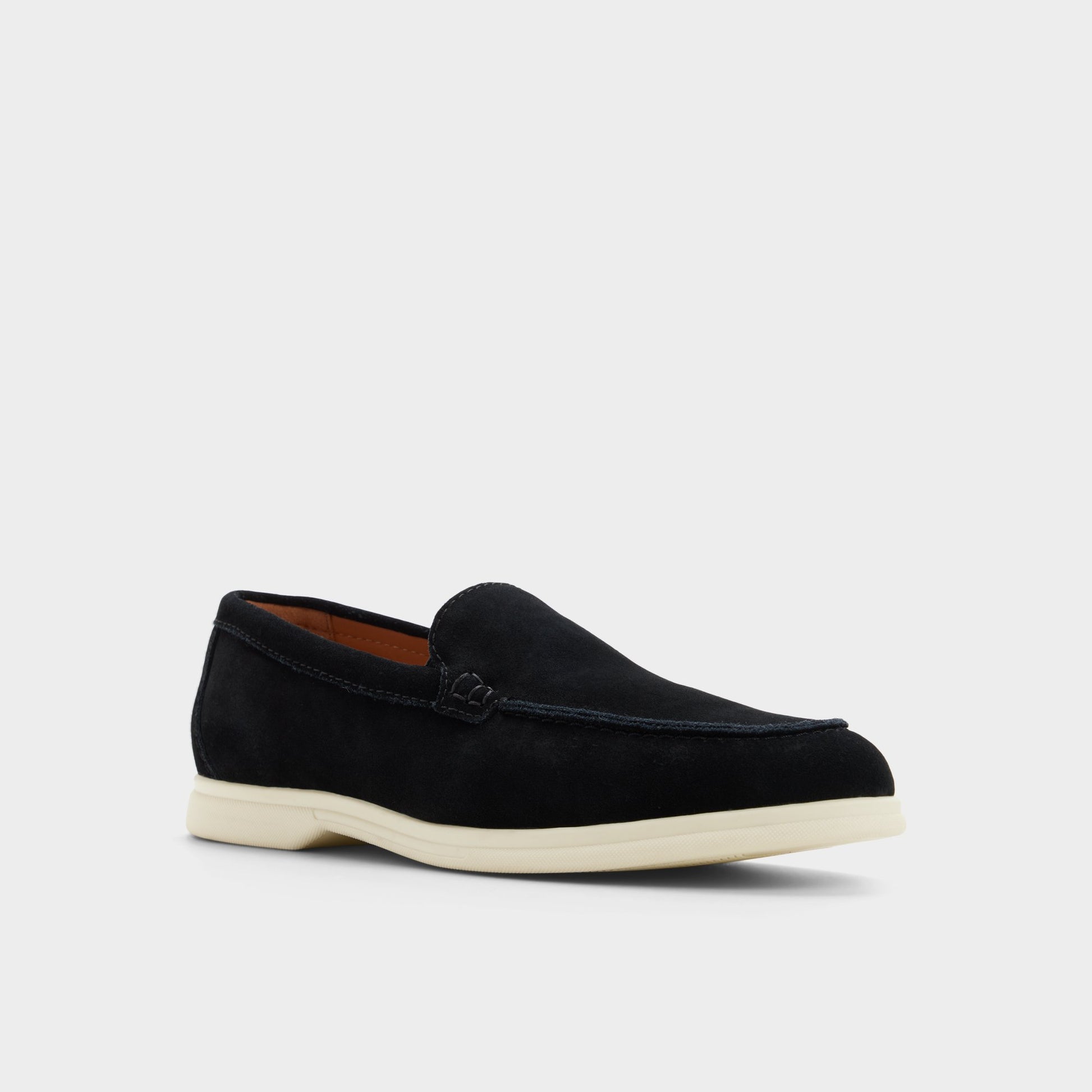 Three-quarter angle of Black Dolan Slip-on's front side