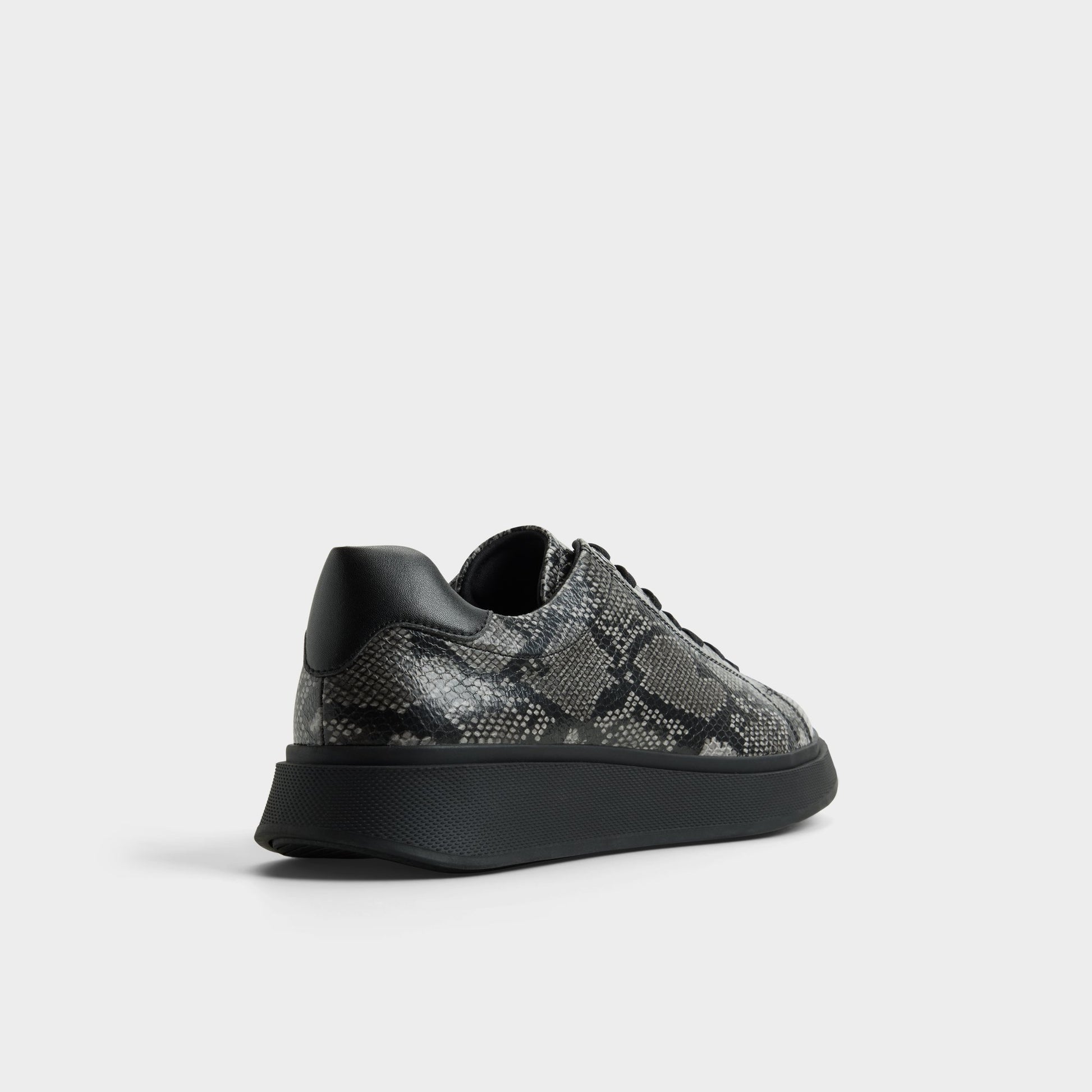 Three-quarter angle of Black combo Magnus Low top sneaker's back side