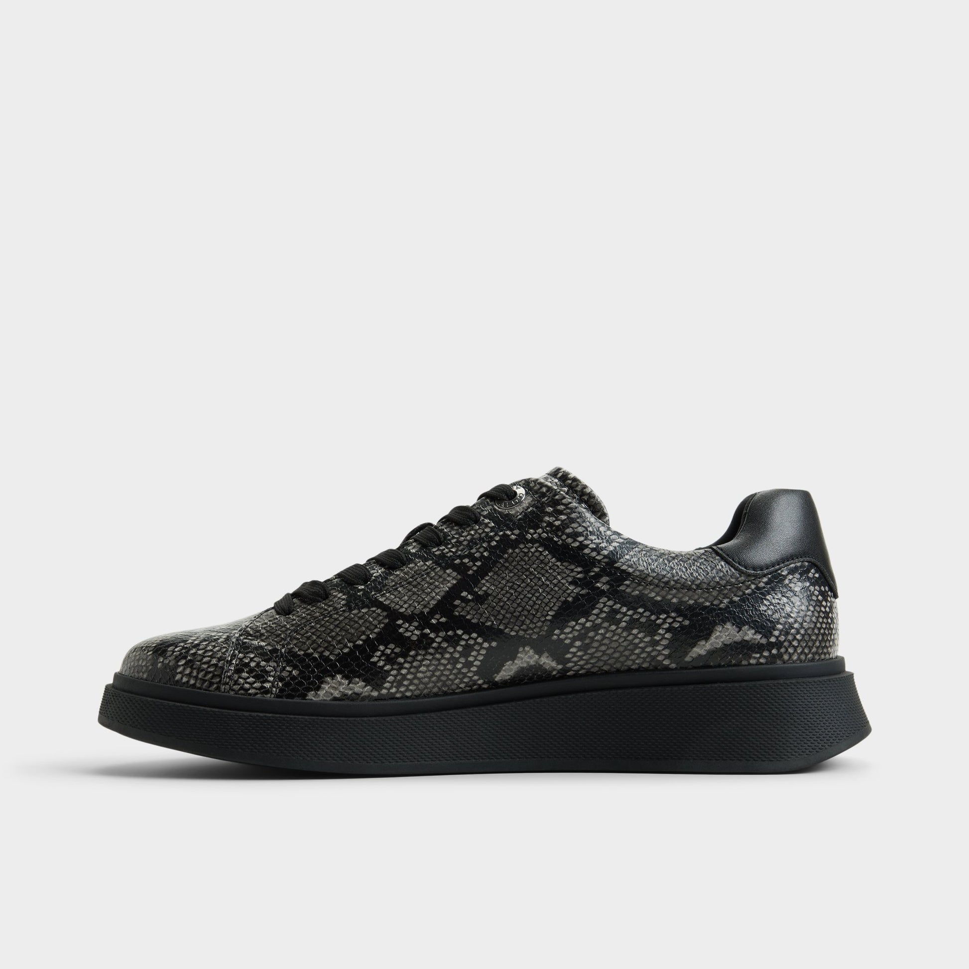 Side view of Black combo Magnus Low top sneaker