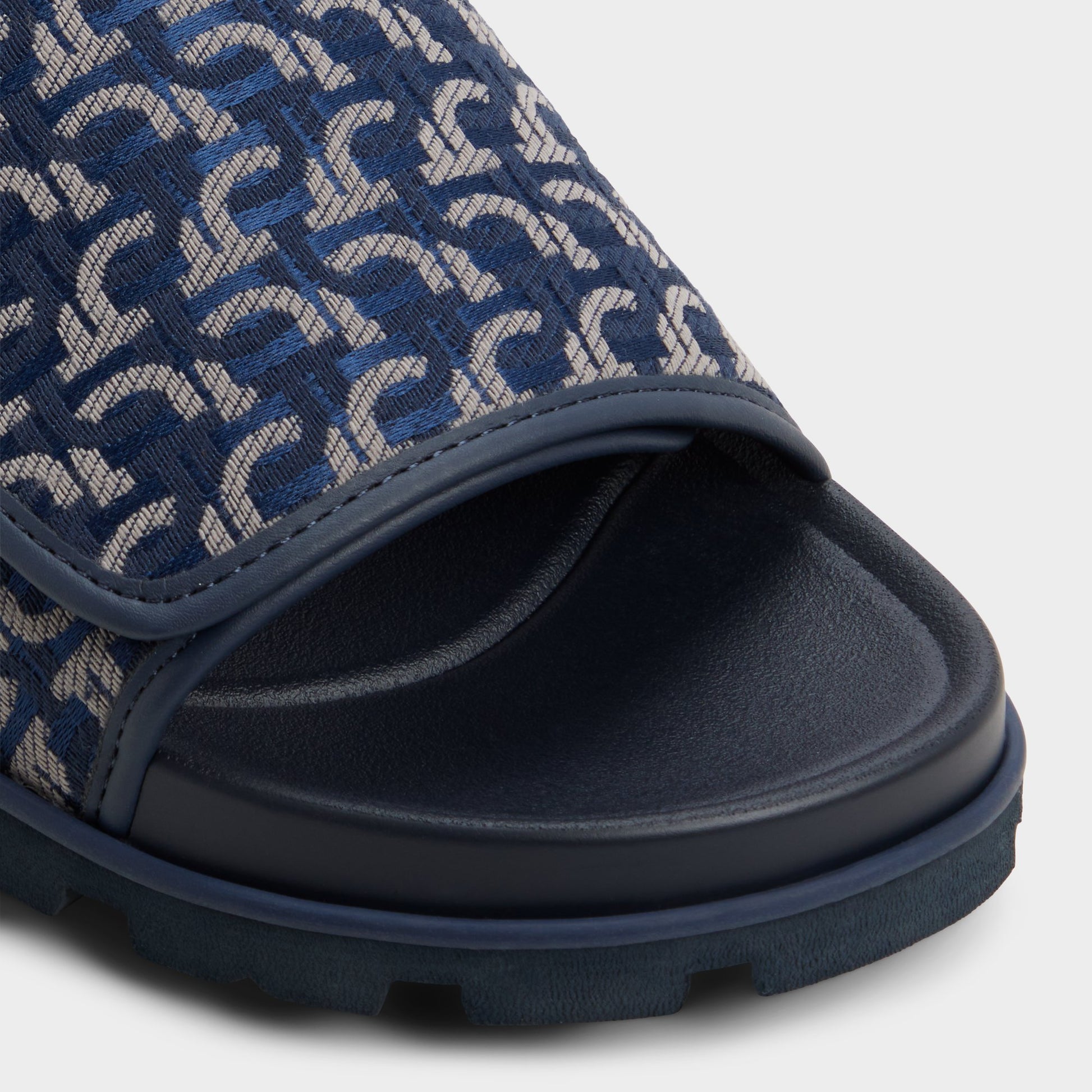 Close-up of the Navy Orian Slide sandal