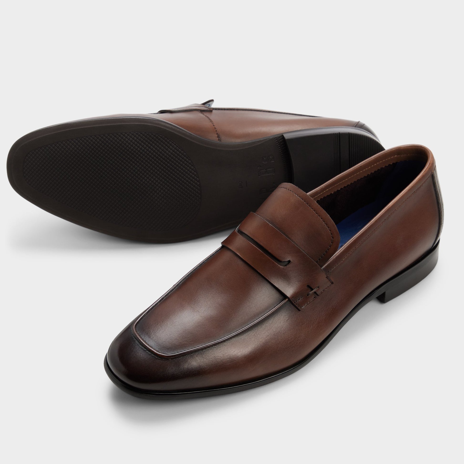 Highlighted view of a pair of Cognac Frazer Loafers