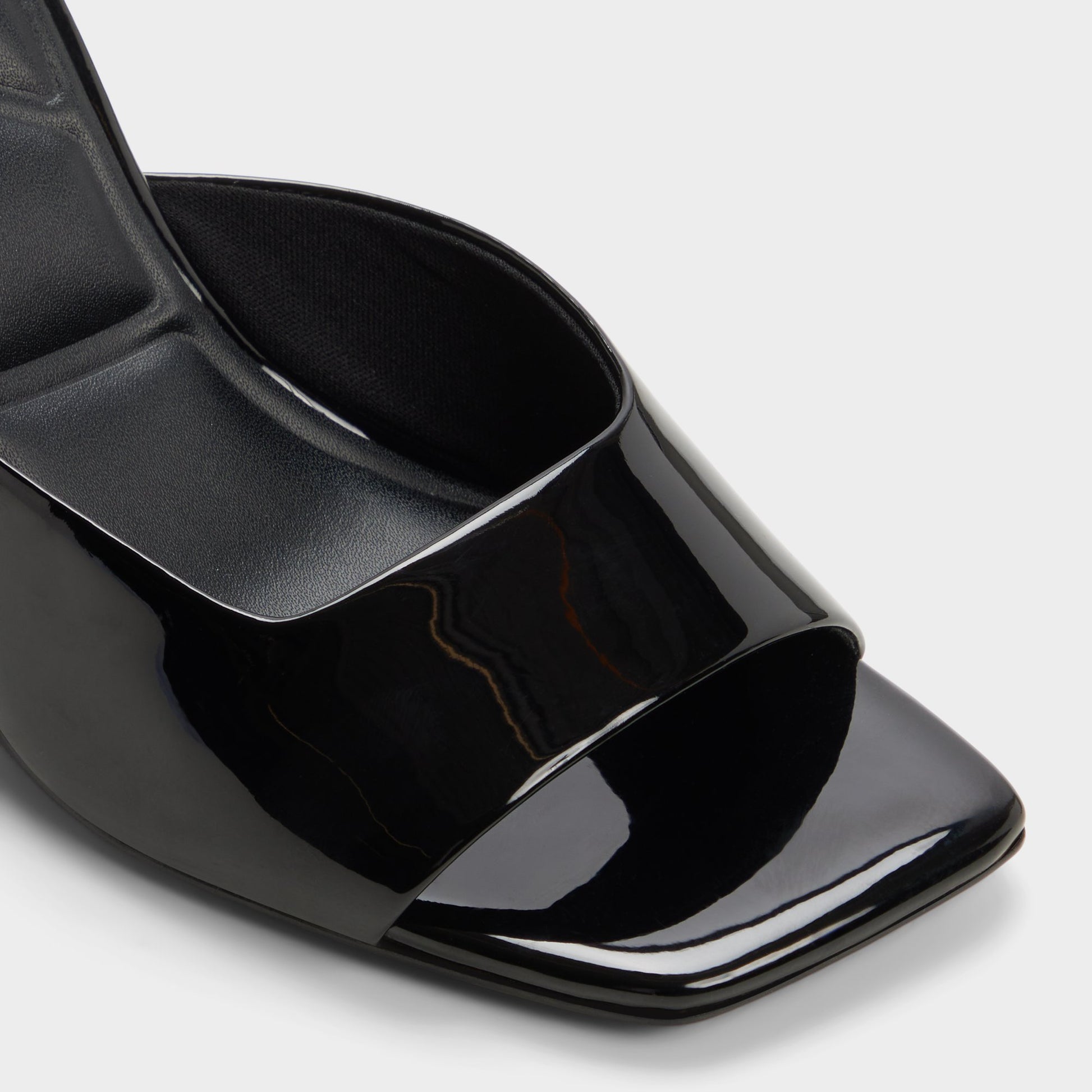 Close-up of the Black Luminae Wedge sandal