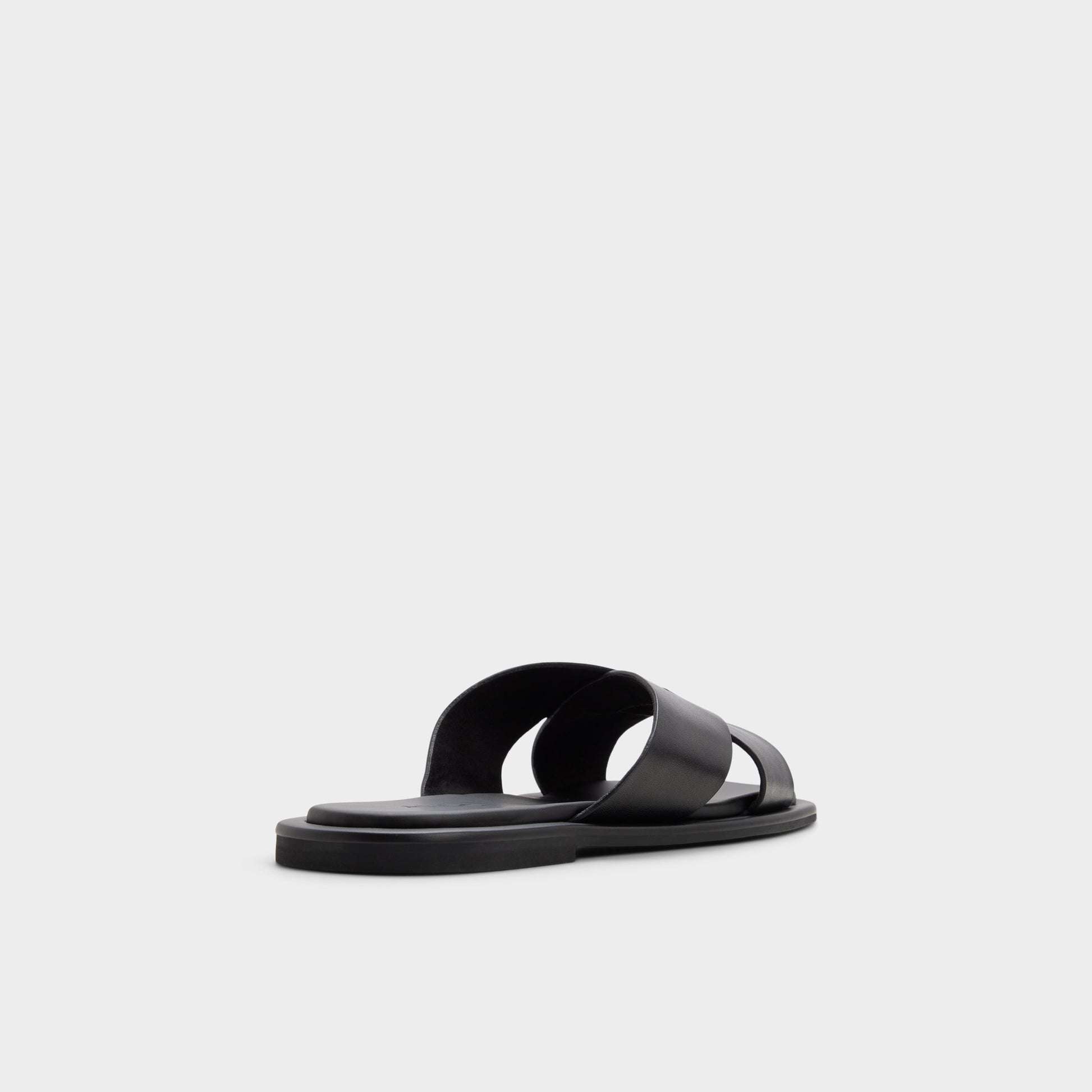 Three-quarter angle of Black/black Emris Slide sandal's back side