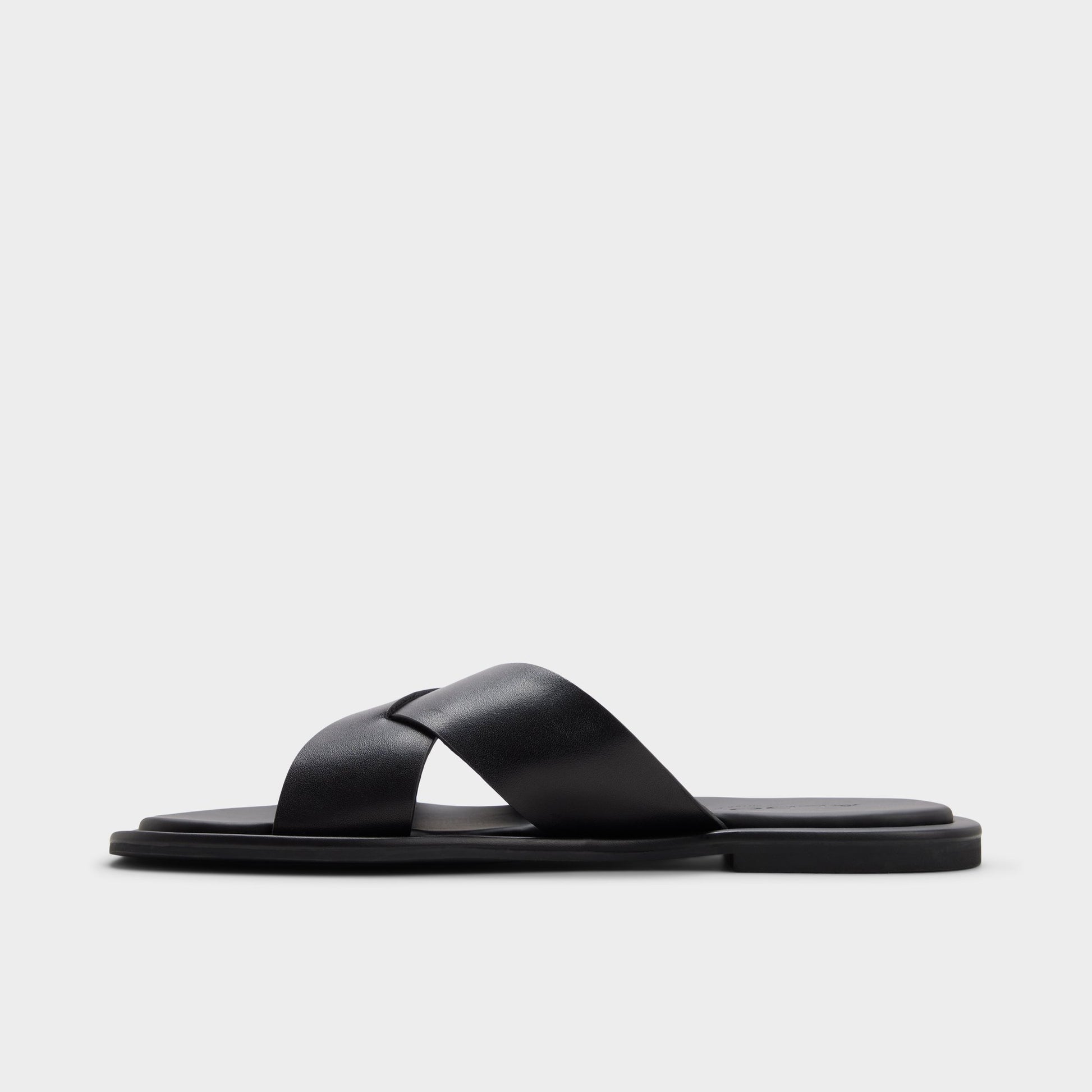 Side view of Black/black Emris Slide sandal