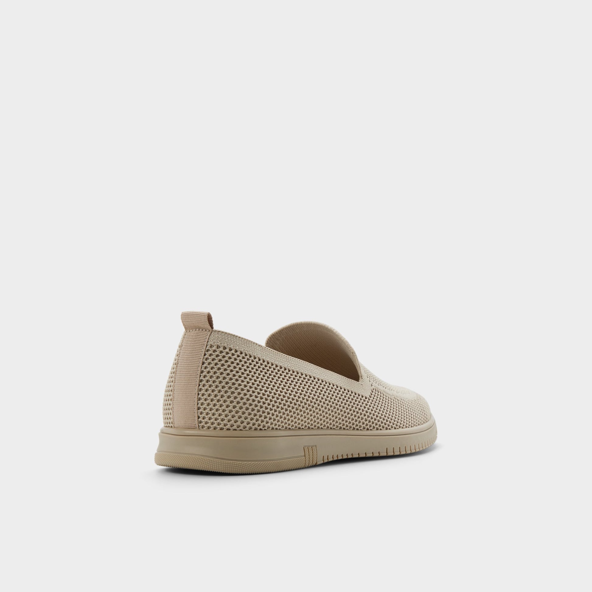 Three-quarter angle of Open beige Luxton Slip-on's back side