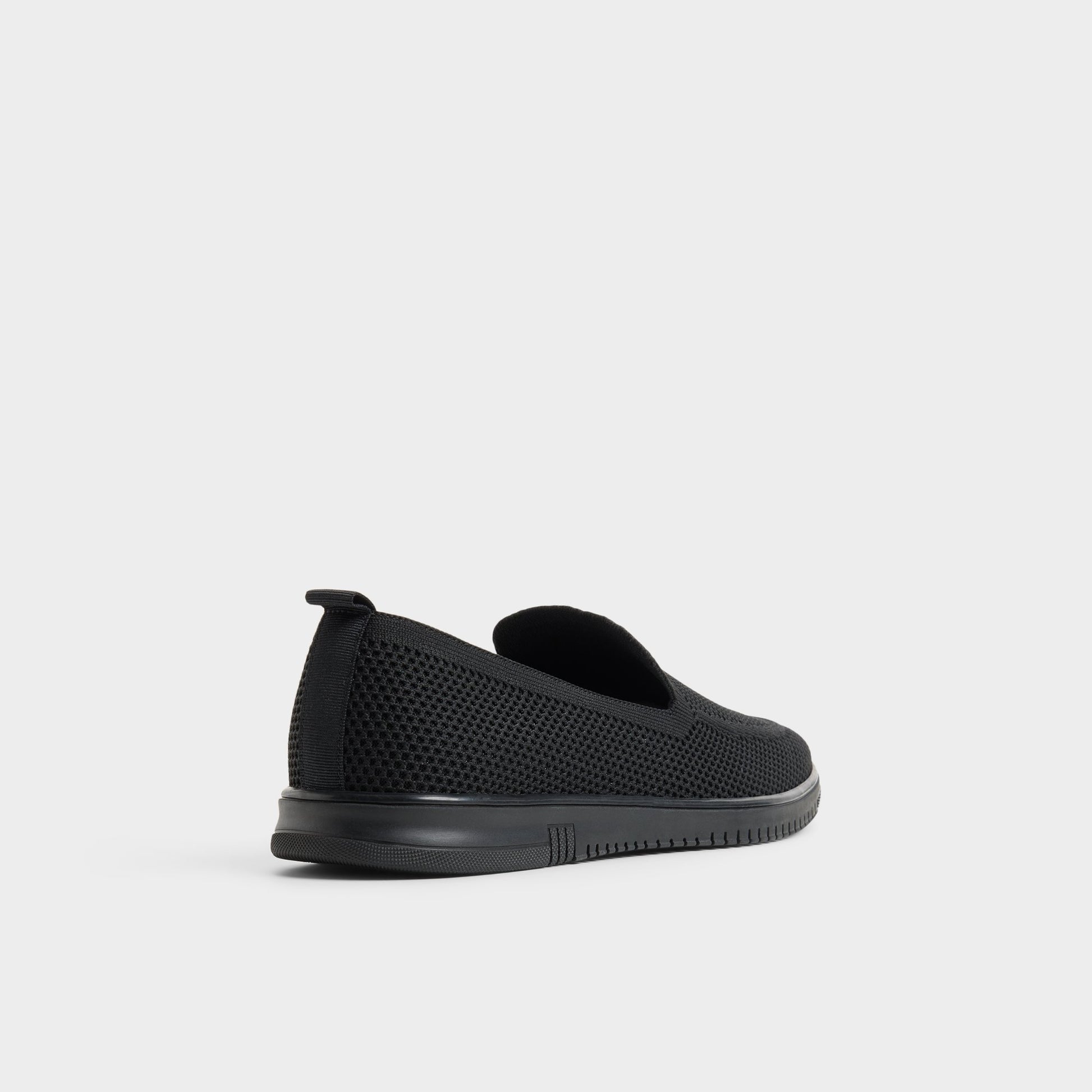 Three-quarter angle of Black Luxton Slip-on's back side