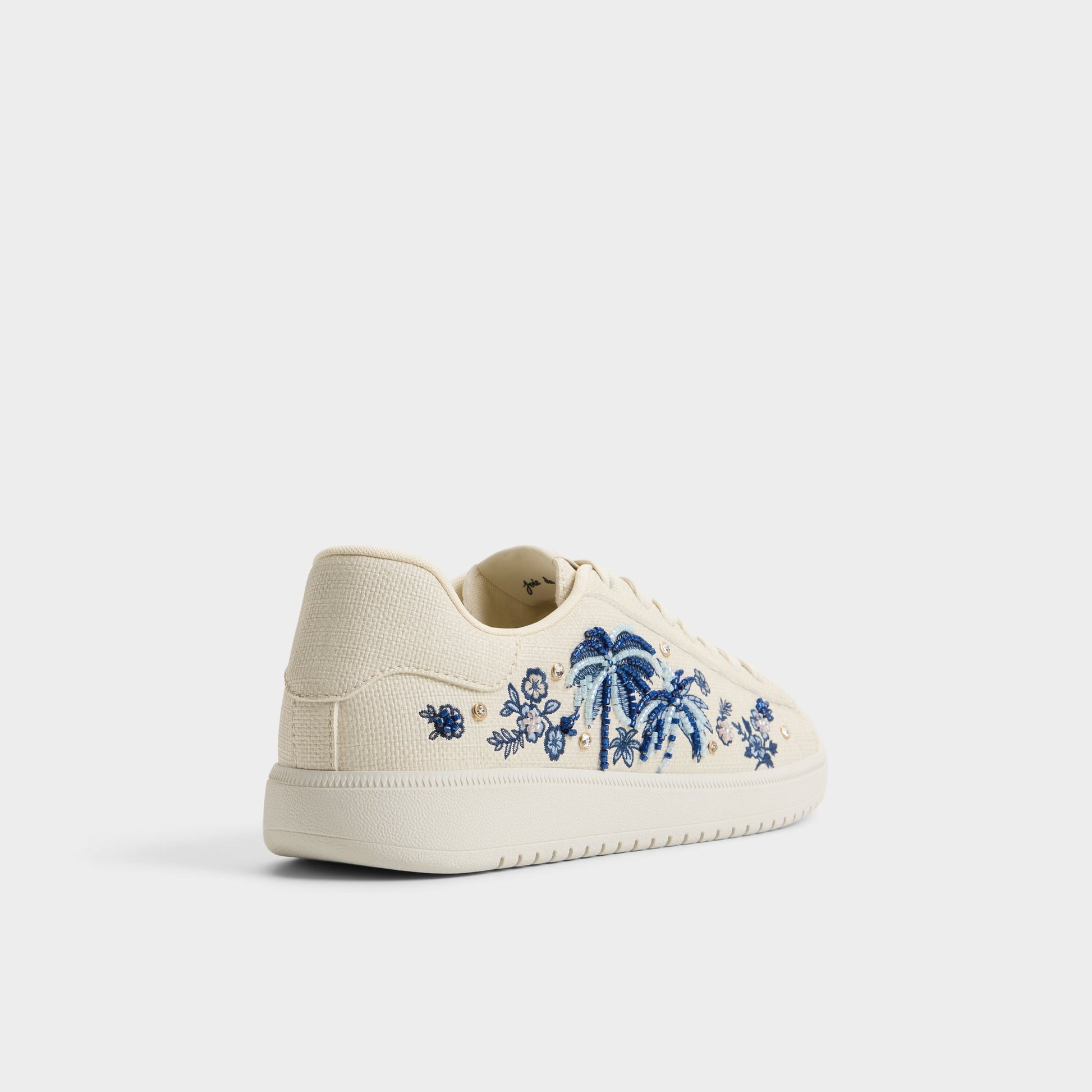 Three-quarter angle of White/blue Palmtree Sneaker's back side