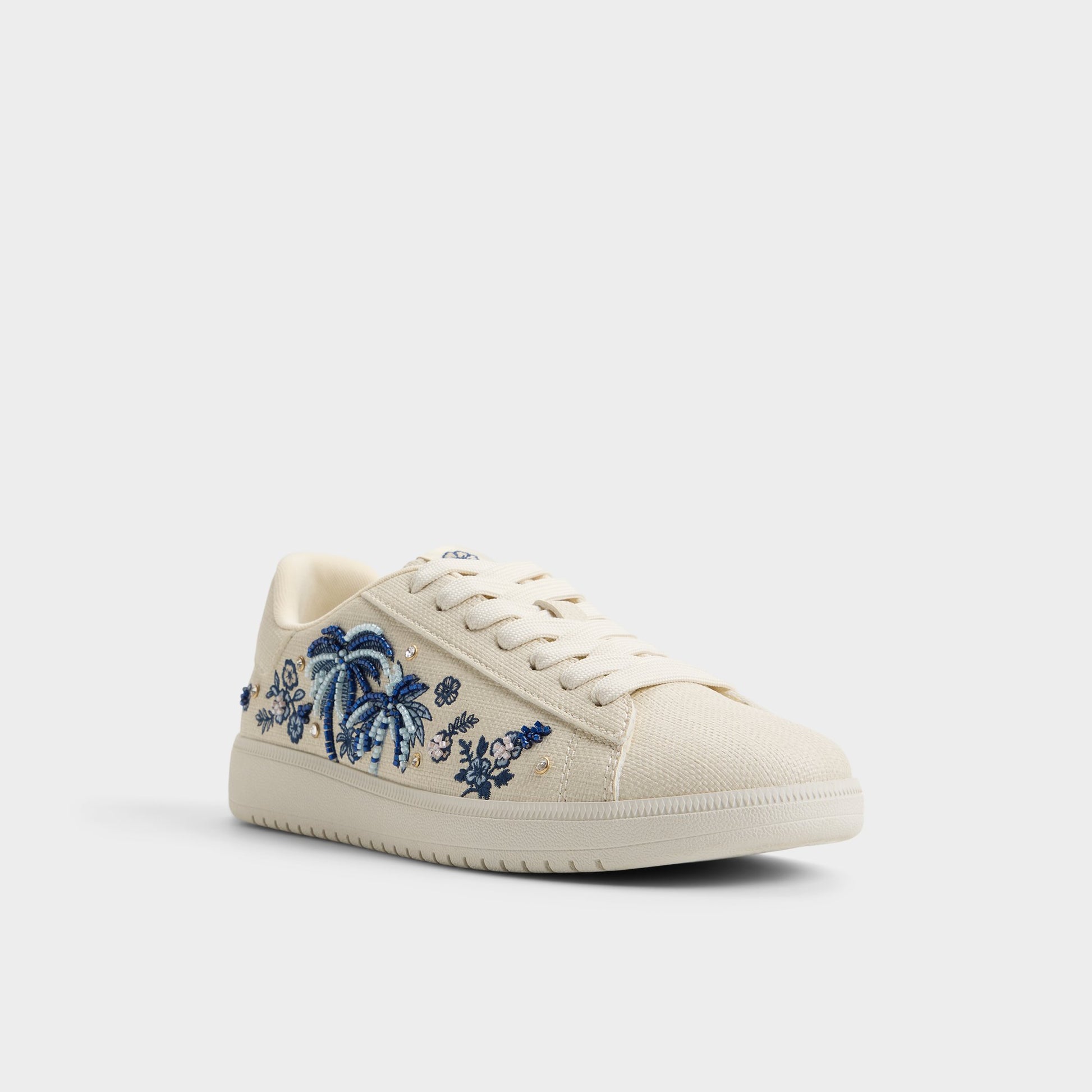 Three-quarter angle of White/blue Palmtree Sneaker's front side