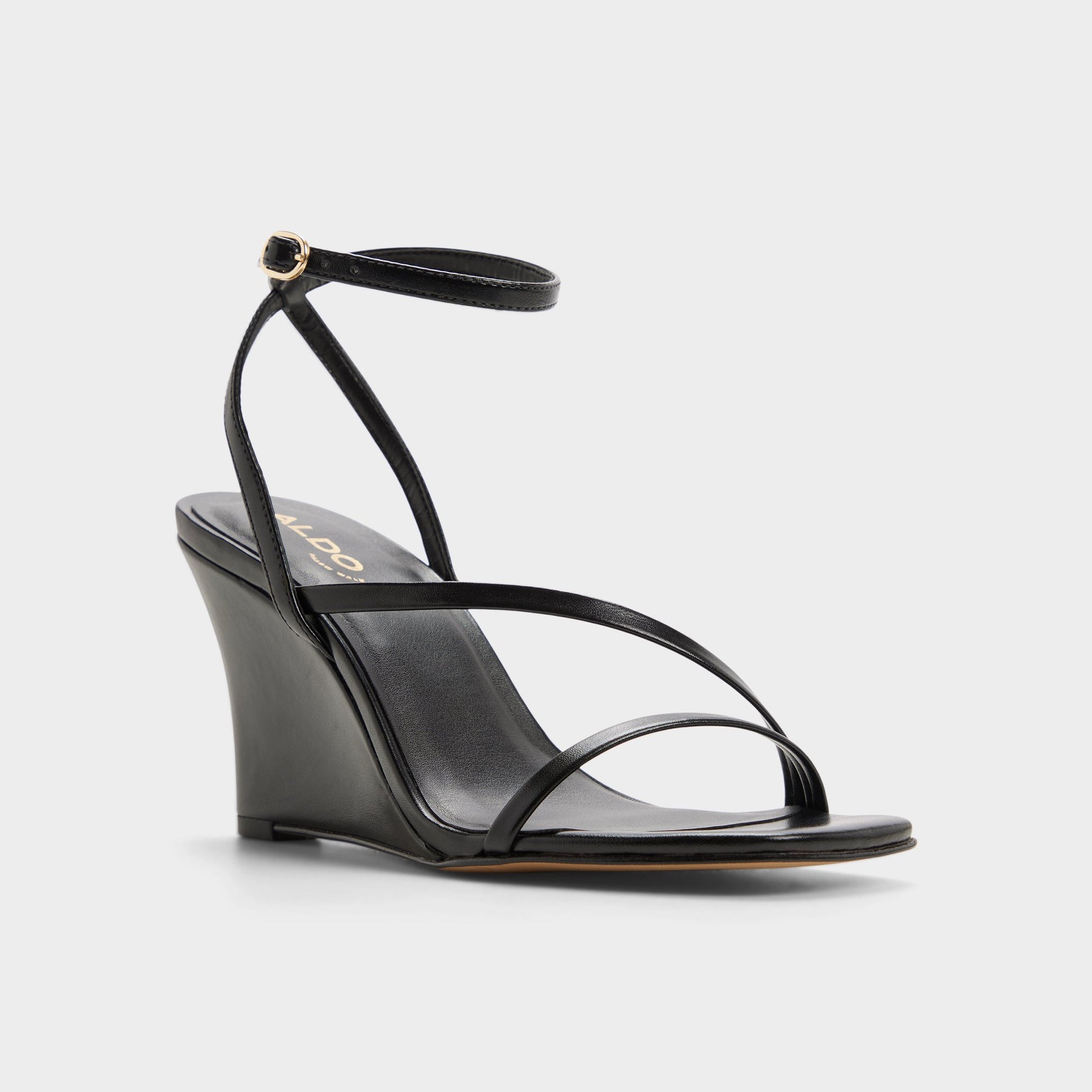 Three-quarter angle of Black Lineria Strappy wedge sandal's front side