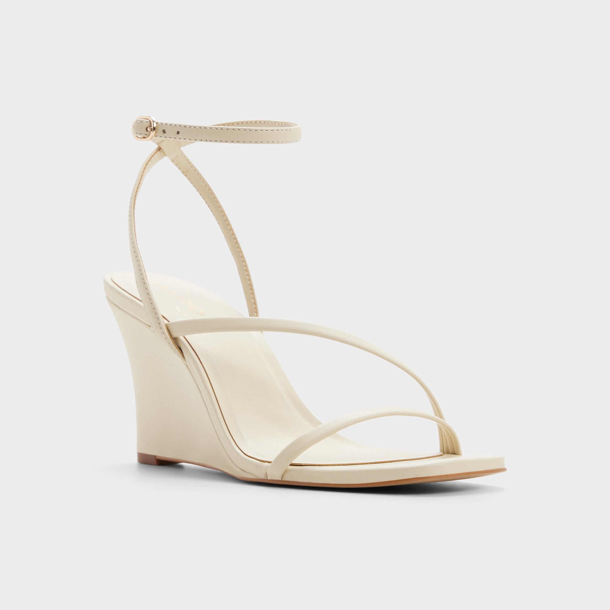 Three-quarter angle of Cream Lineria Strappy wedge sandal's front side