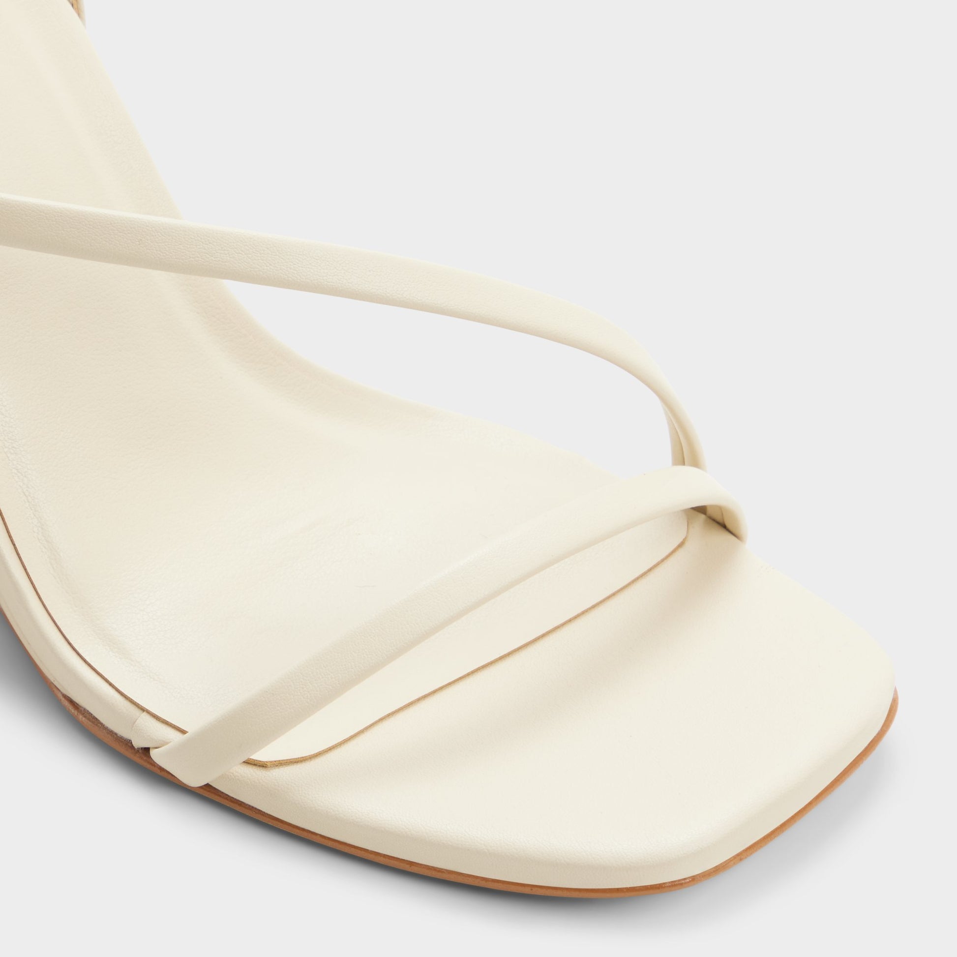 Close-up of the Cream Lineria Strappy wedge sandal