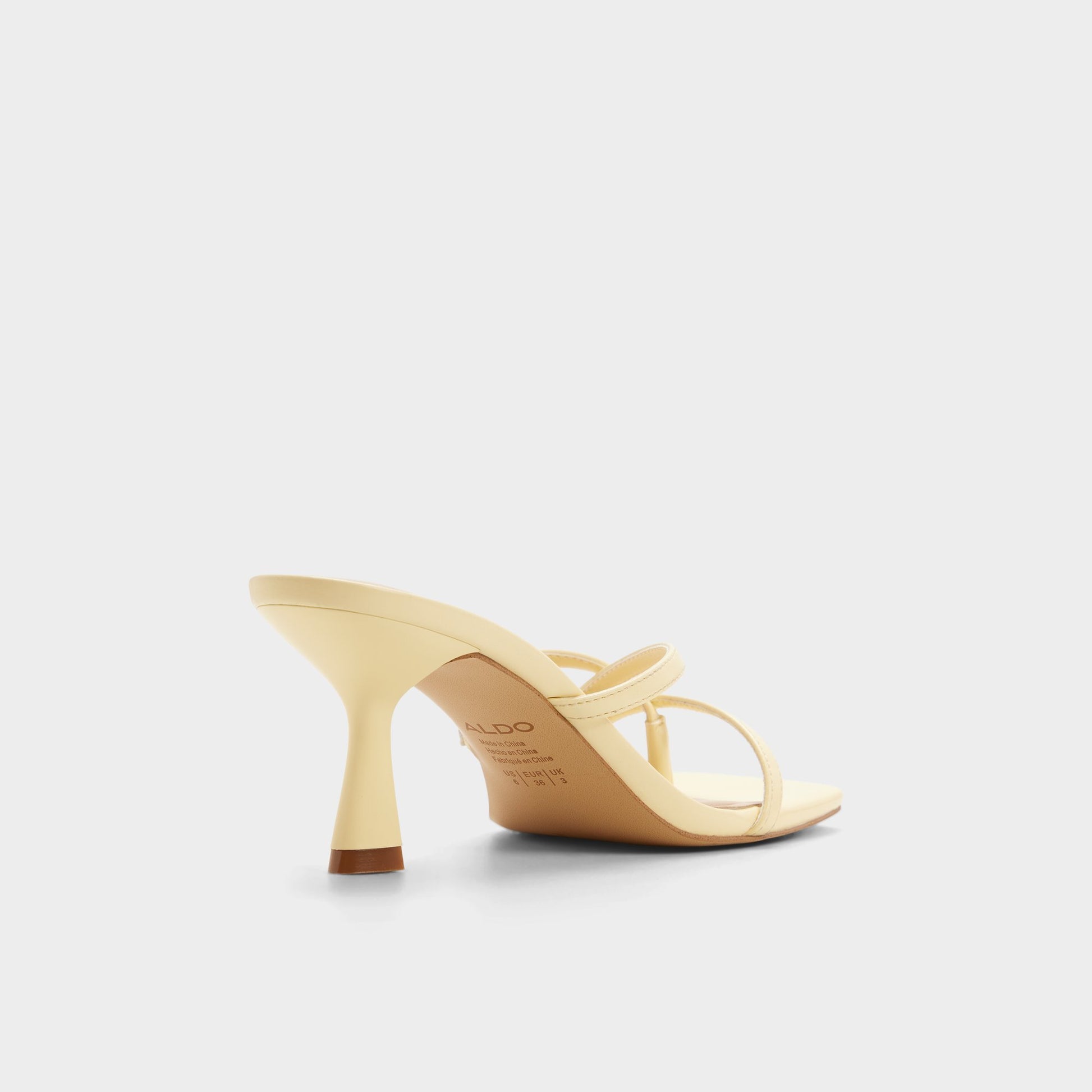 Three-quarter angle of Light yellow Calypsaa Heeled mule's back side