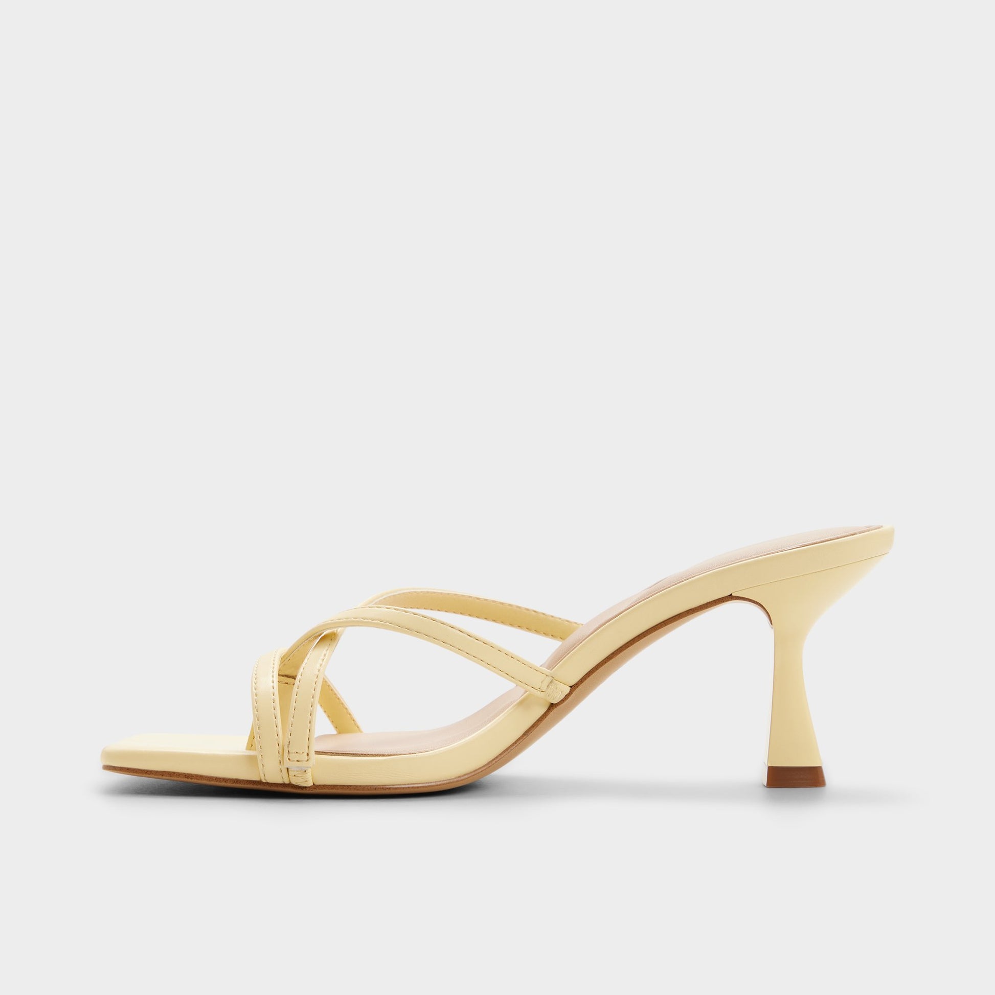 Side view of Light yellow Calypsaa Heeled mule