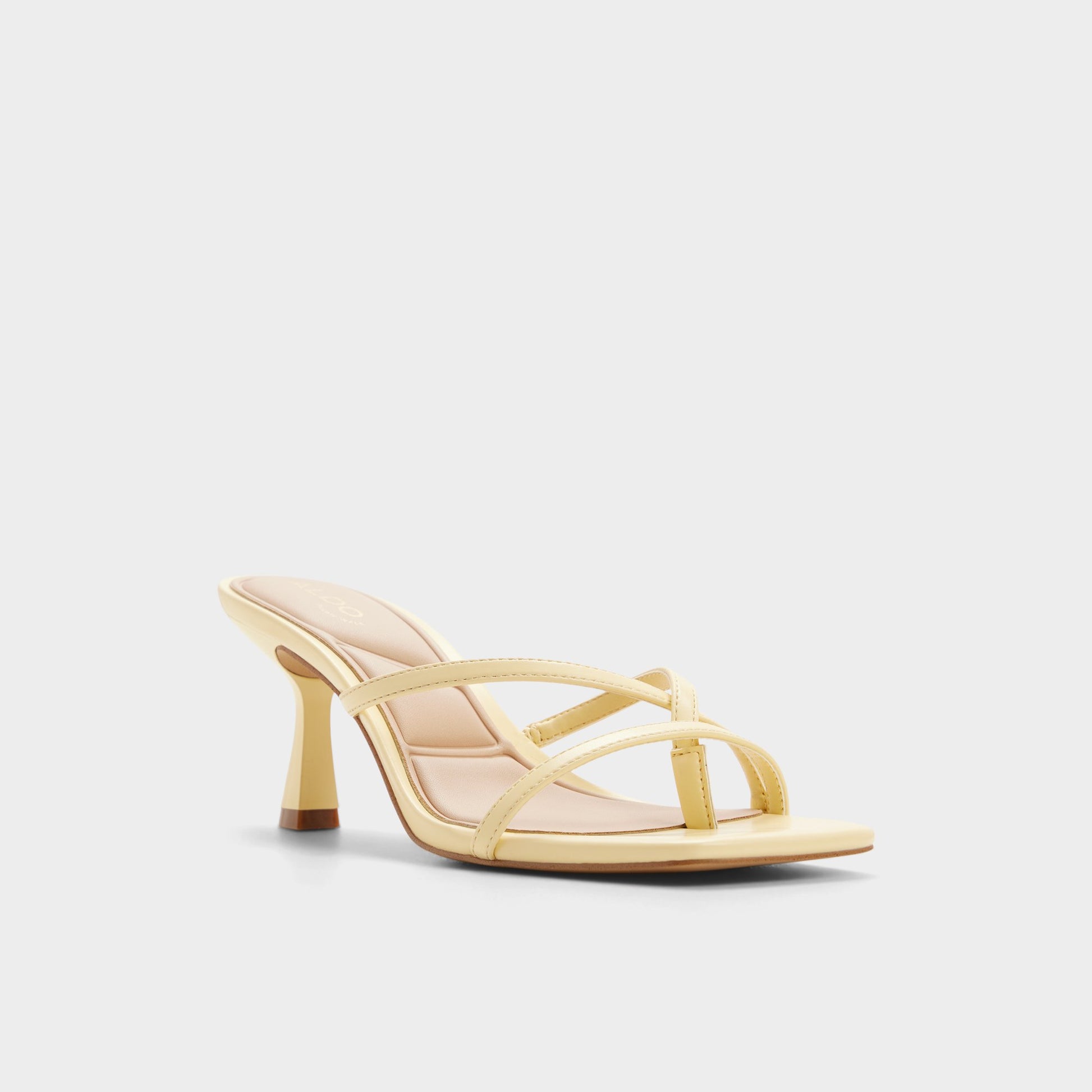 Three-quarter angle of Light yellow Calypsaa Heeled mule's front side