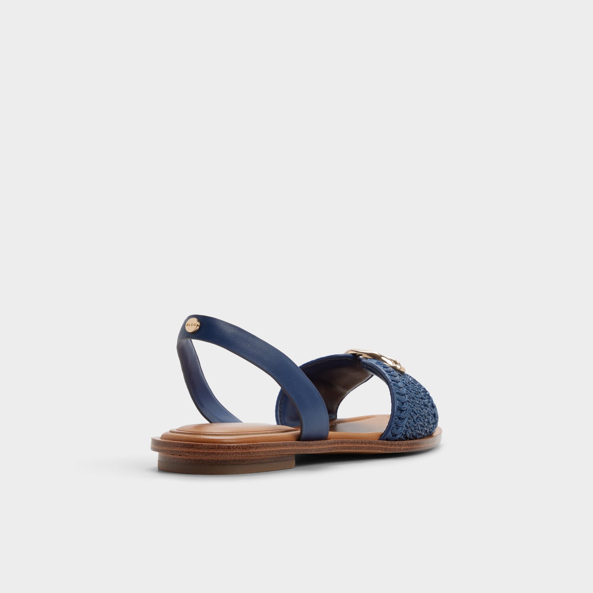 Three-quarter angle of Navy Calelian Flat sandal's back side