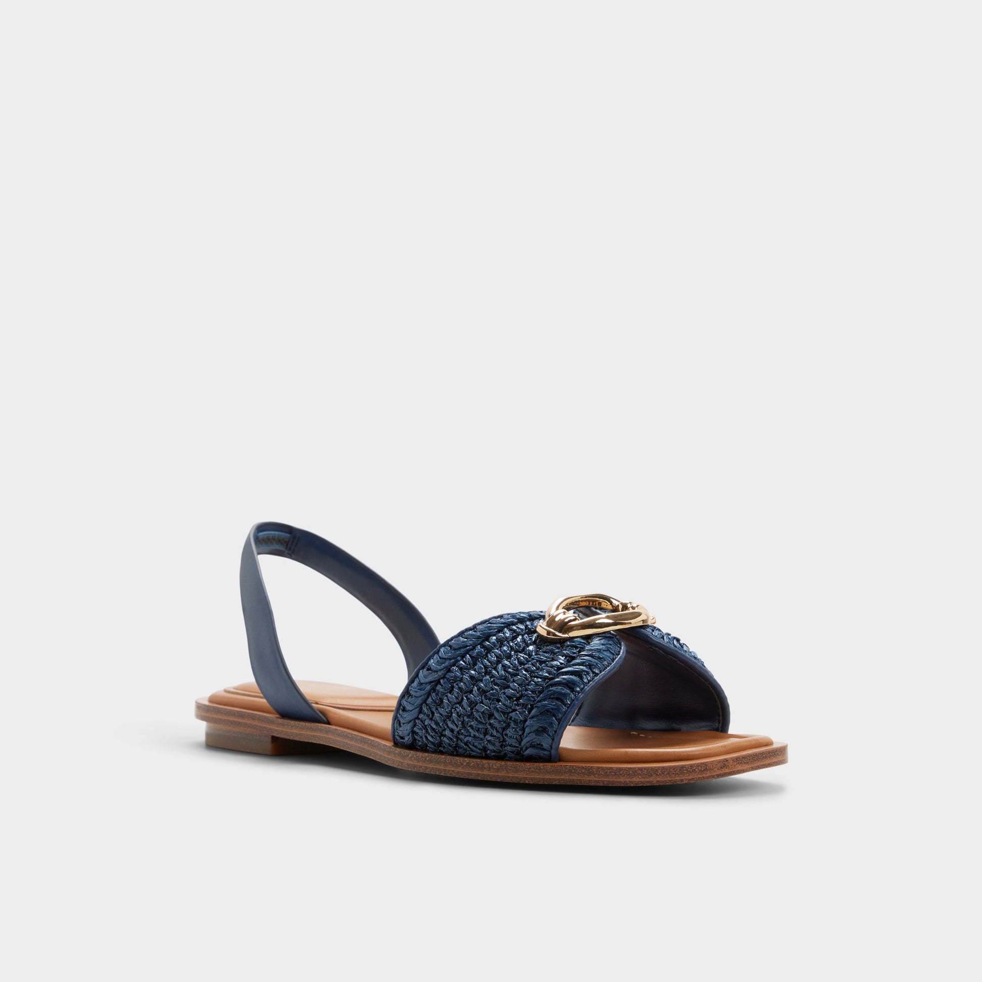 Three-quarter angle of Navy Calelian Flat sandal's front side