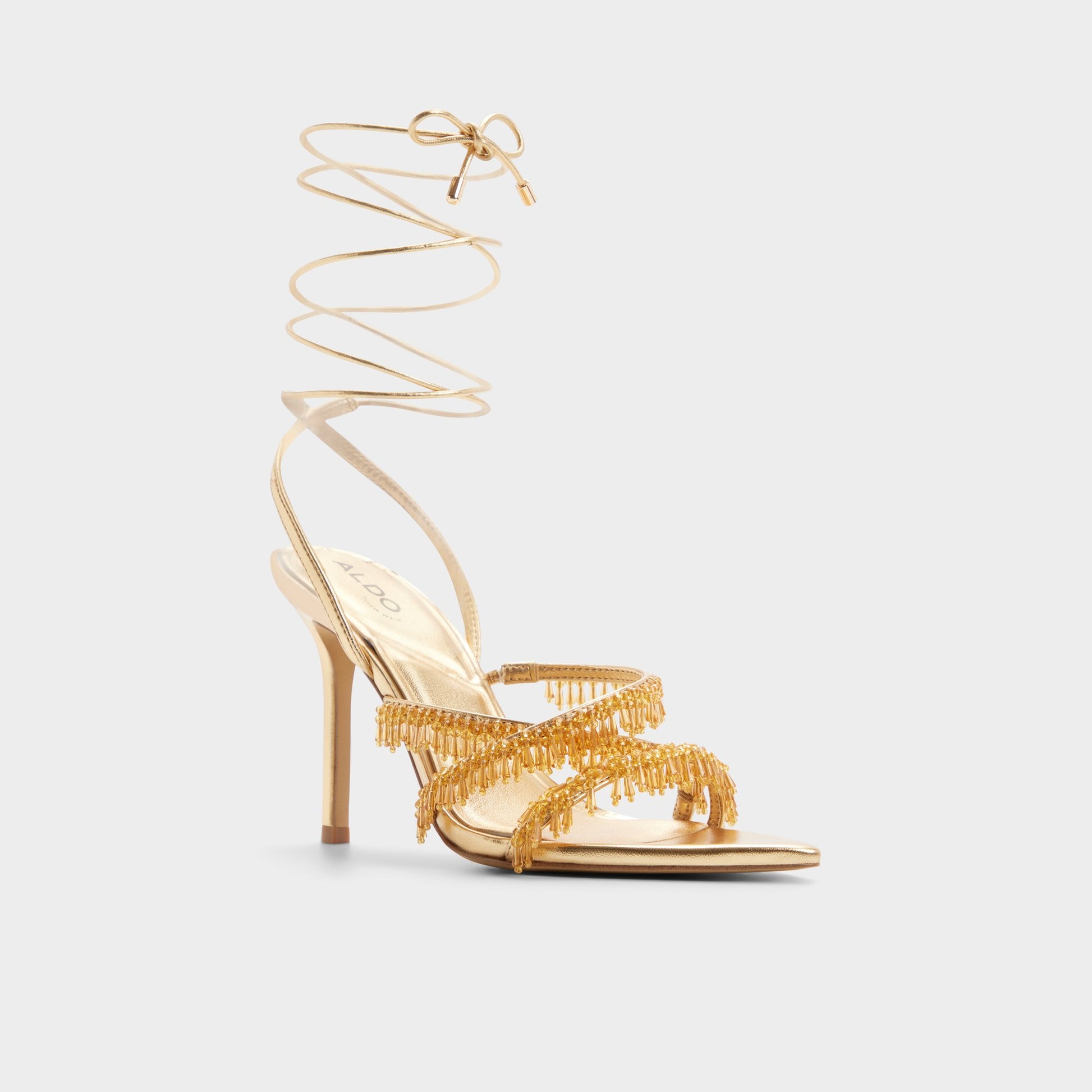 Three-quarter angle of Gold Flaming Strappy heeled sandal's front side