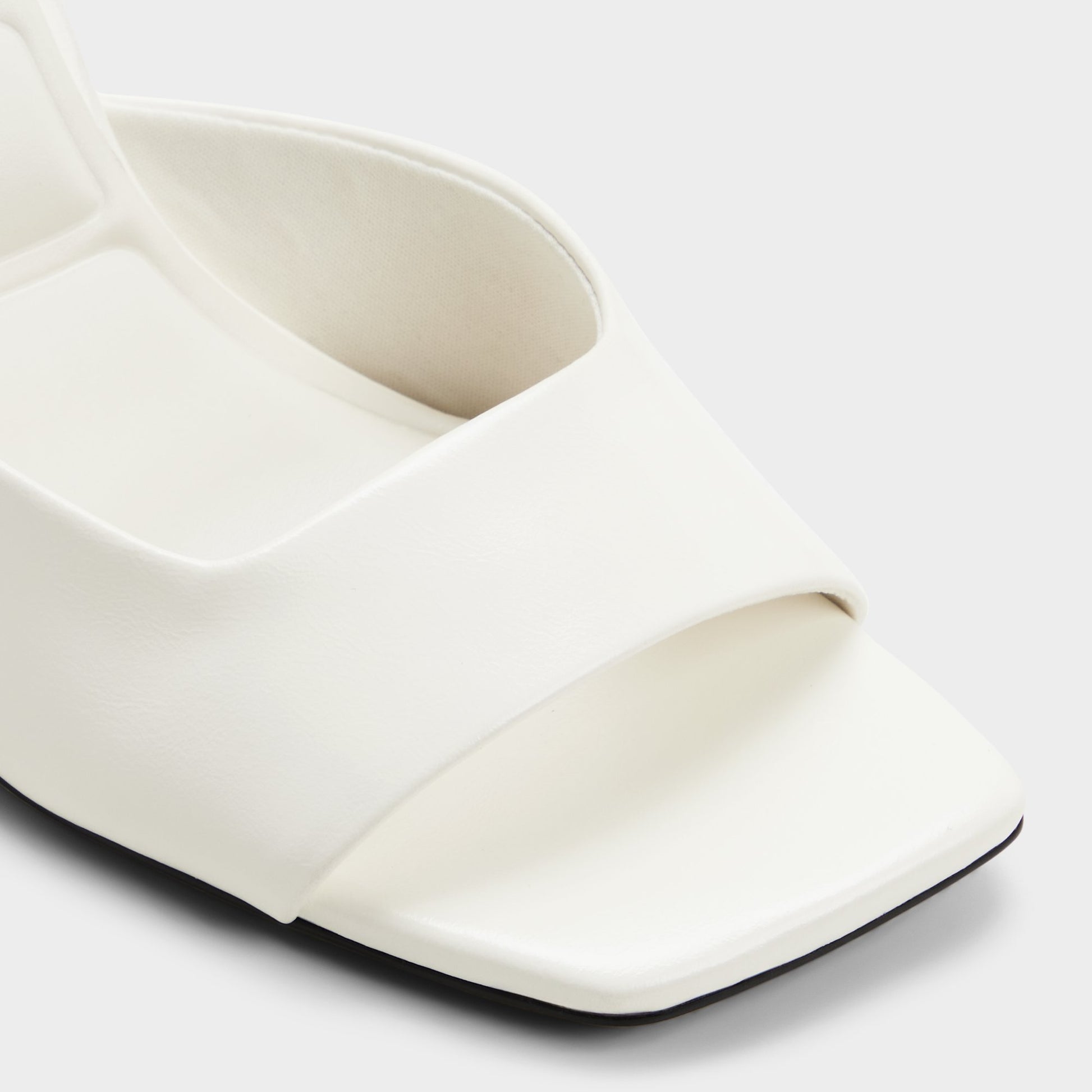 Close-up of the White/bone Luminae Wedge sandal