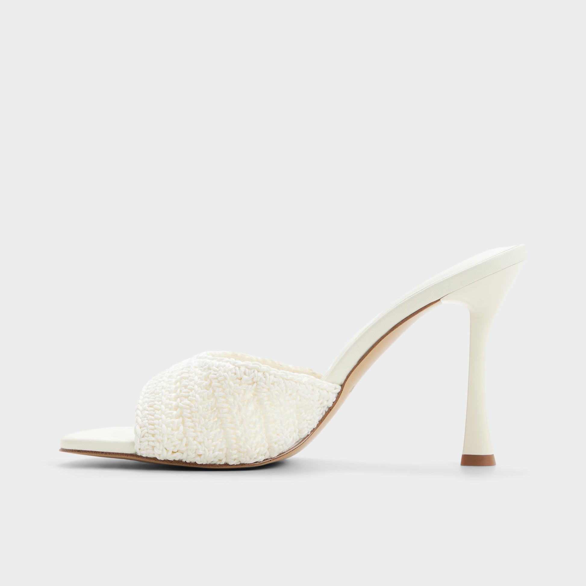 Side view of White/bone Evadalie Heeled mule