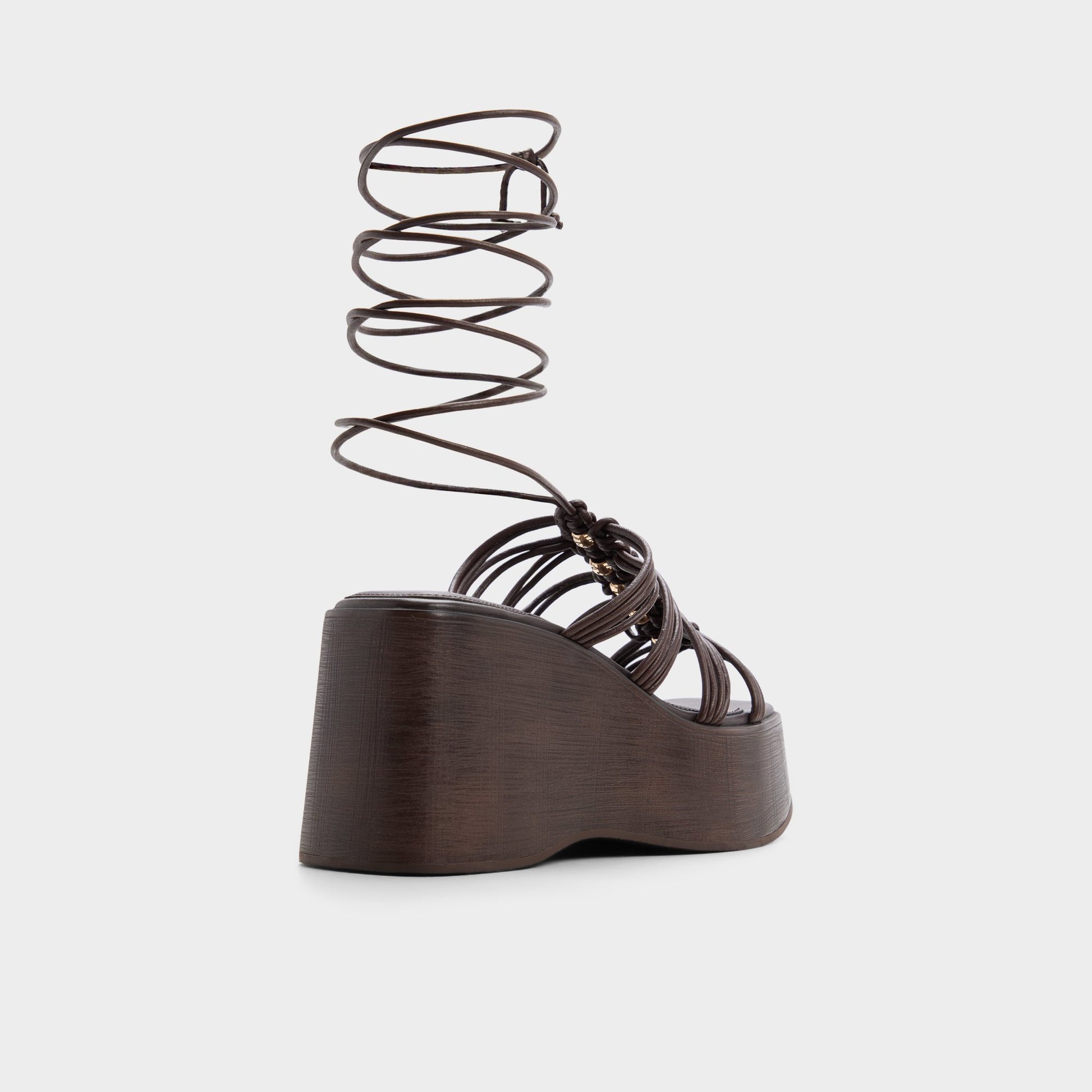 Three-quarter angle of Dark brown Timber Strappy wedge sandal's back side