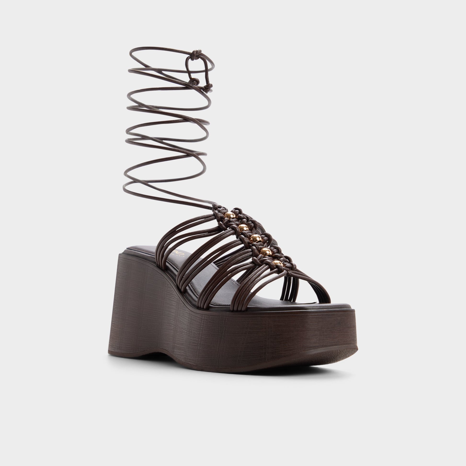 Three-quarter angle of Dark brown Timber Strappy wedge sandal's front side