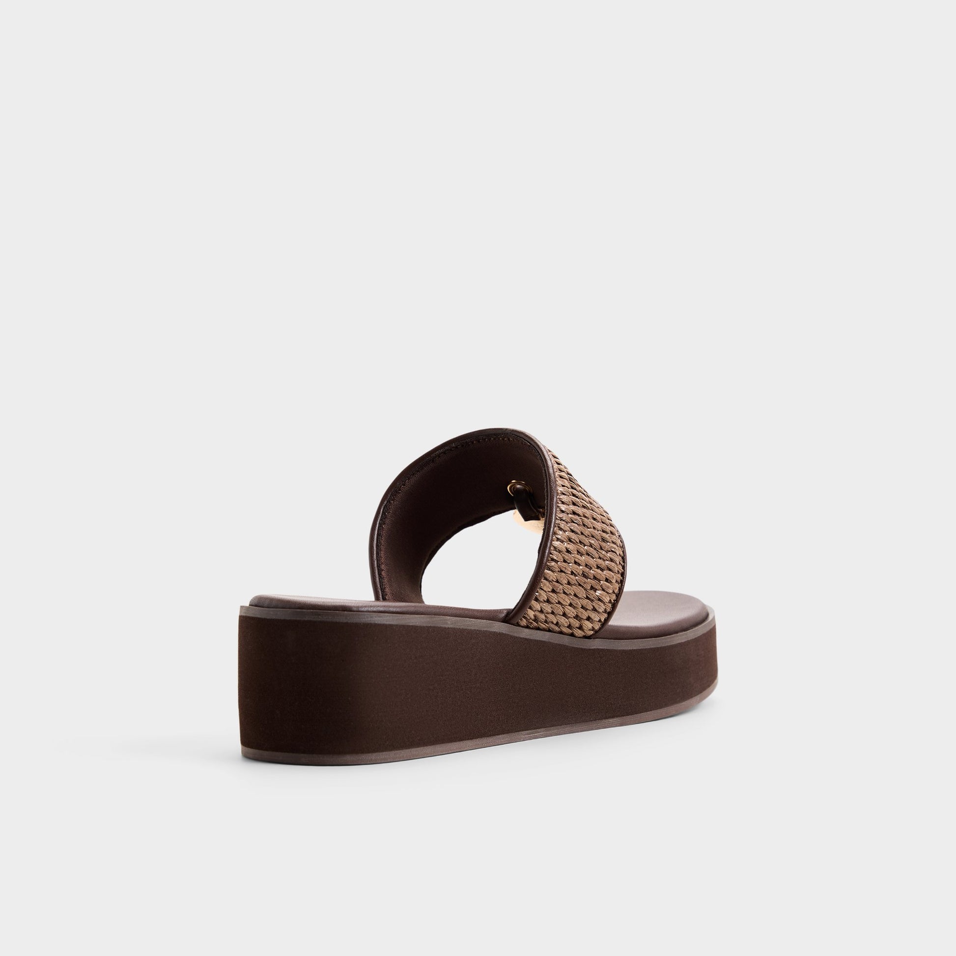 Three-quarter angle of Dark brown Trenala T-strap sandal's back side