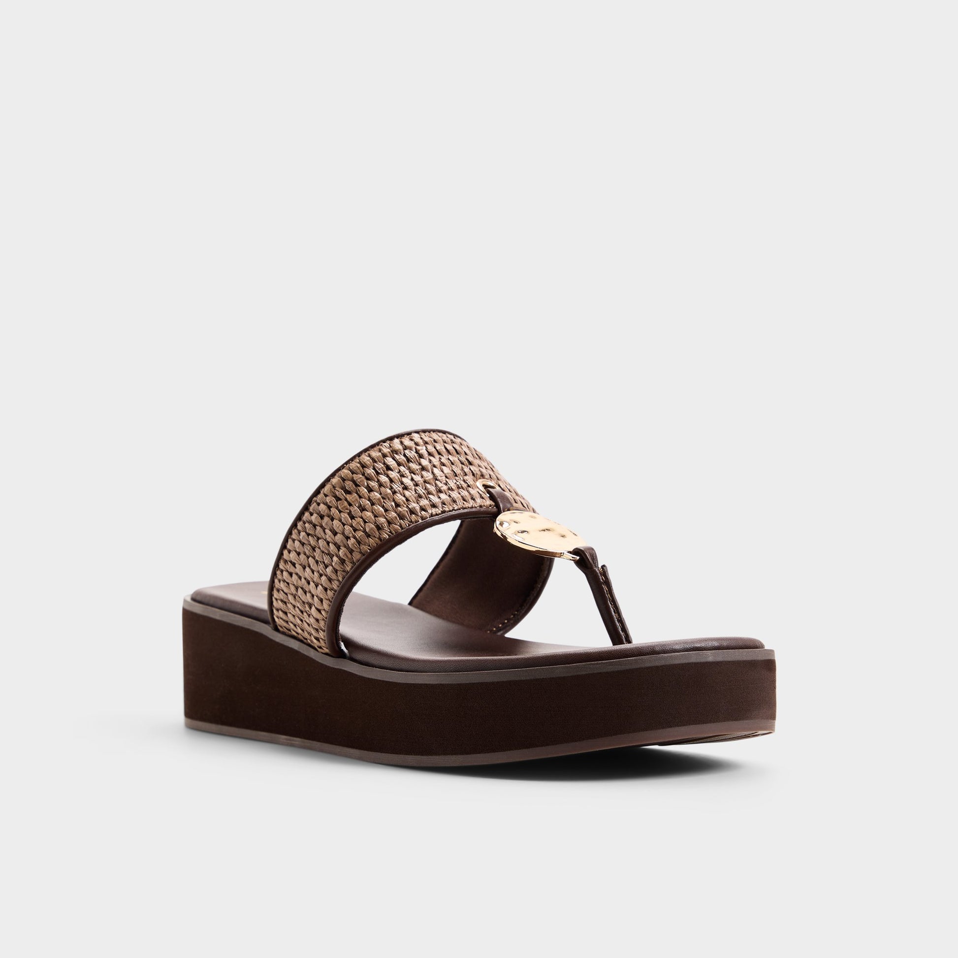 Three-quarter angle of Dark brown Trenala T-strap sandal's front side