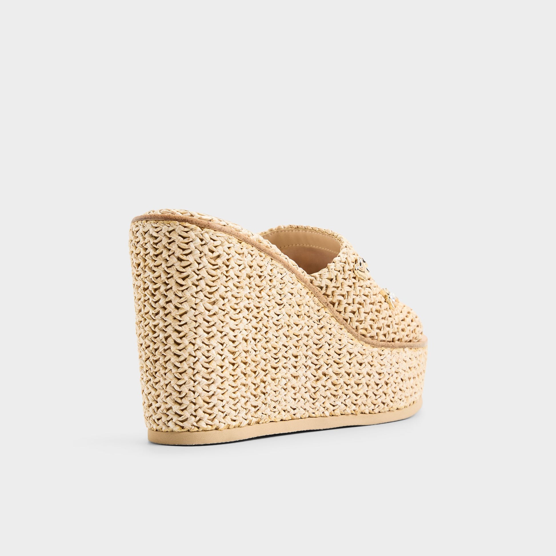 Three-quarter angle of Natural Midsommar Wedge sandal's back side