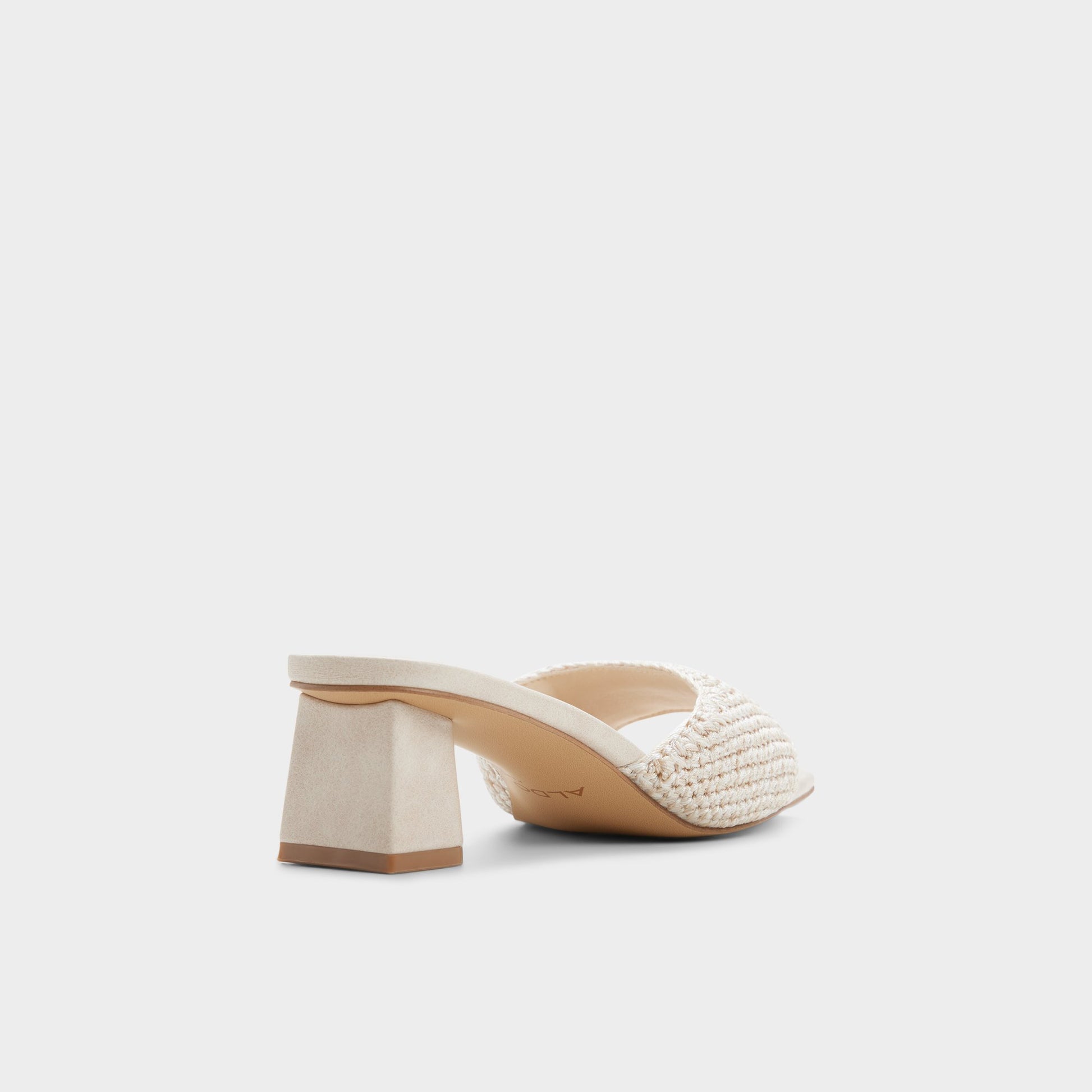 Three-quarter angle of Beige Aneka Heeled mule's back side