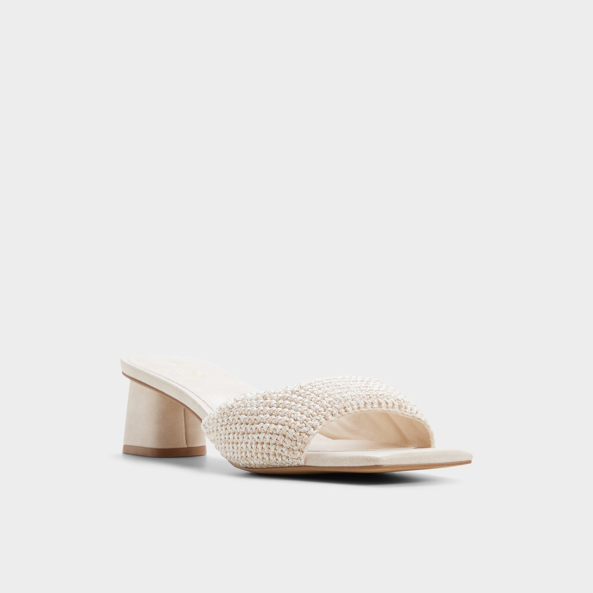 Three-quarter angle of Beige Aneka Heeled mule's front side