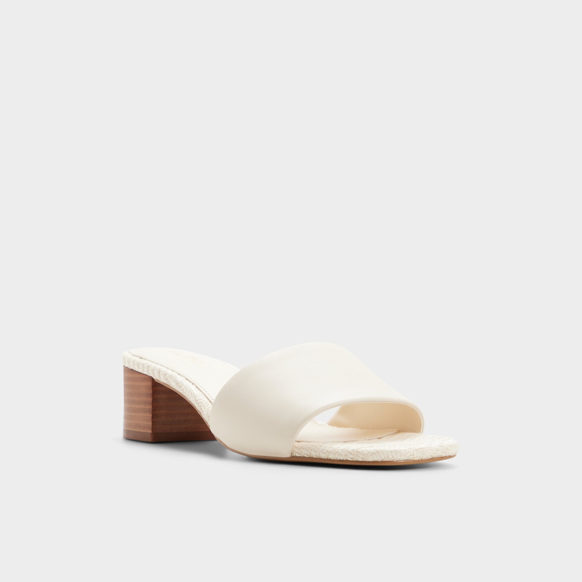 Three-quarter angle of Other white Claudina Heeled mule's front side