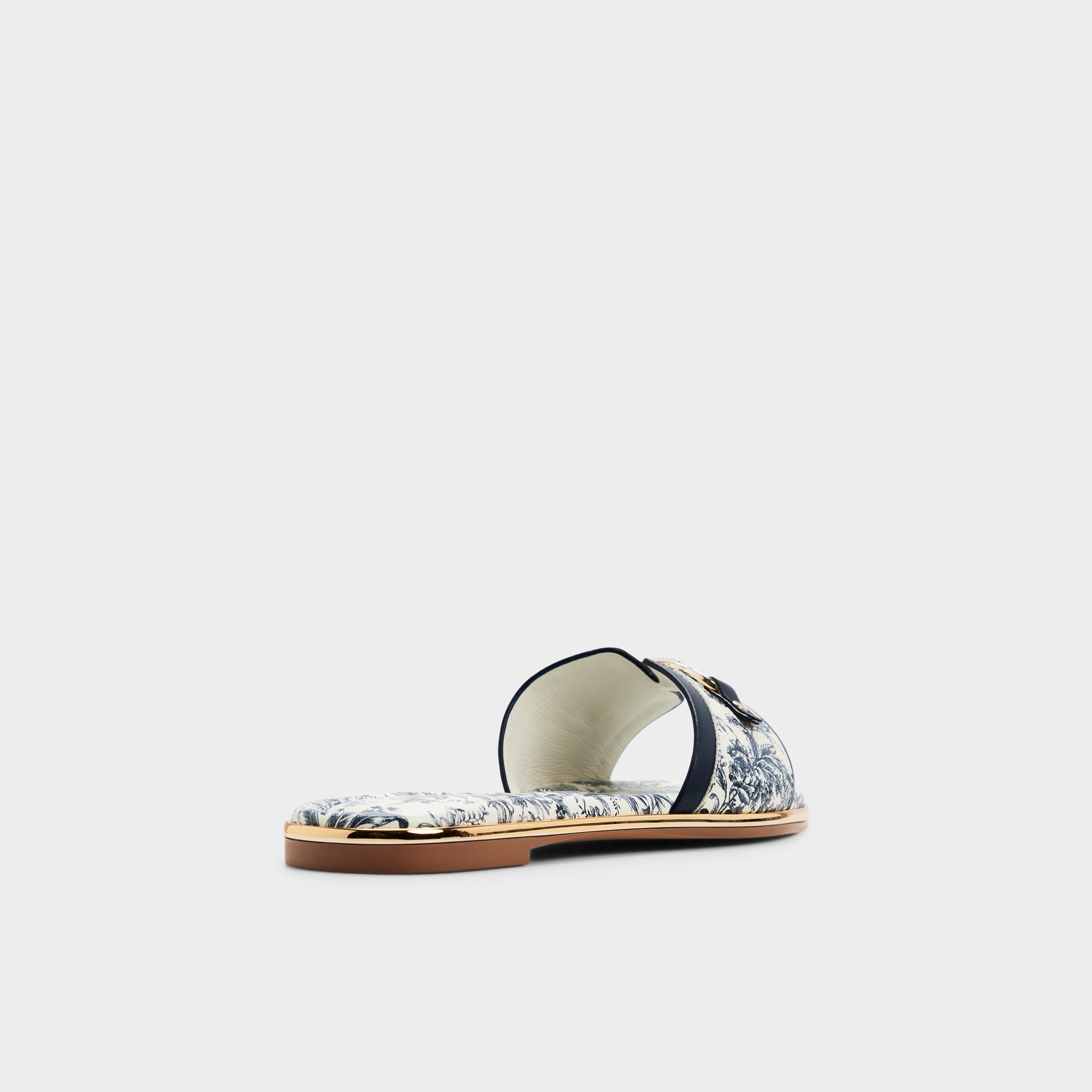 Three-quarter angle of White/blue Alamassi Slide sandal's back side