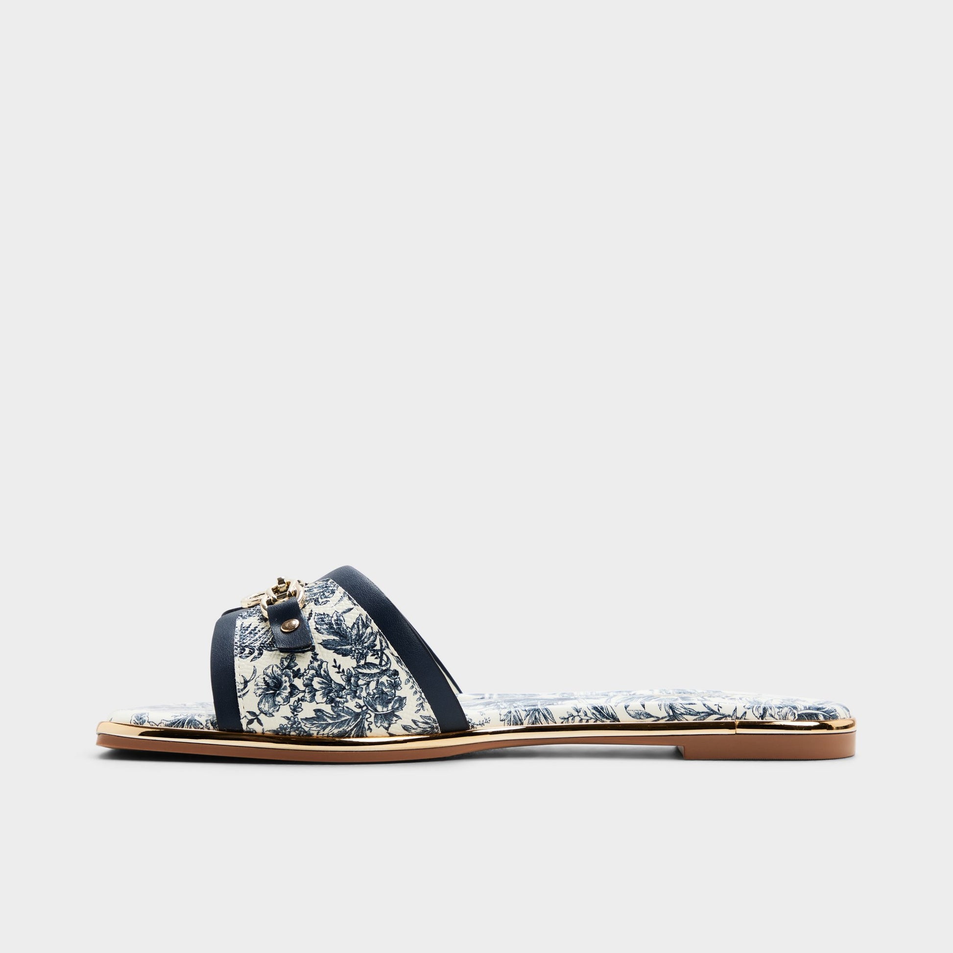 Side view of White/blue Alamassi Slide sandal