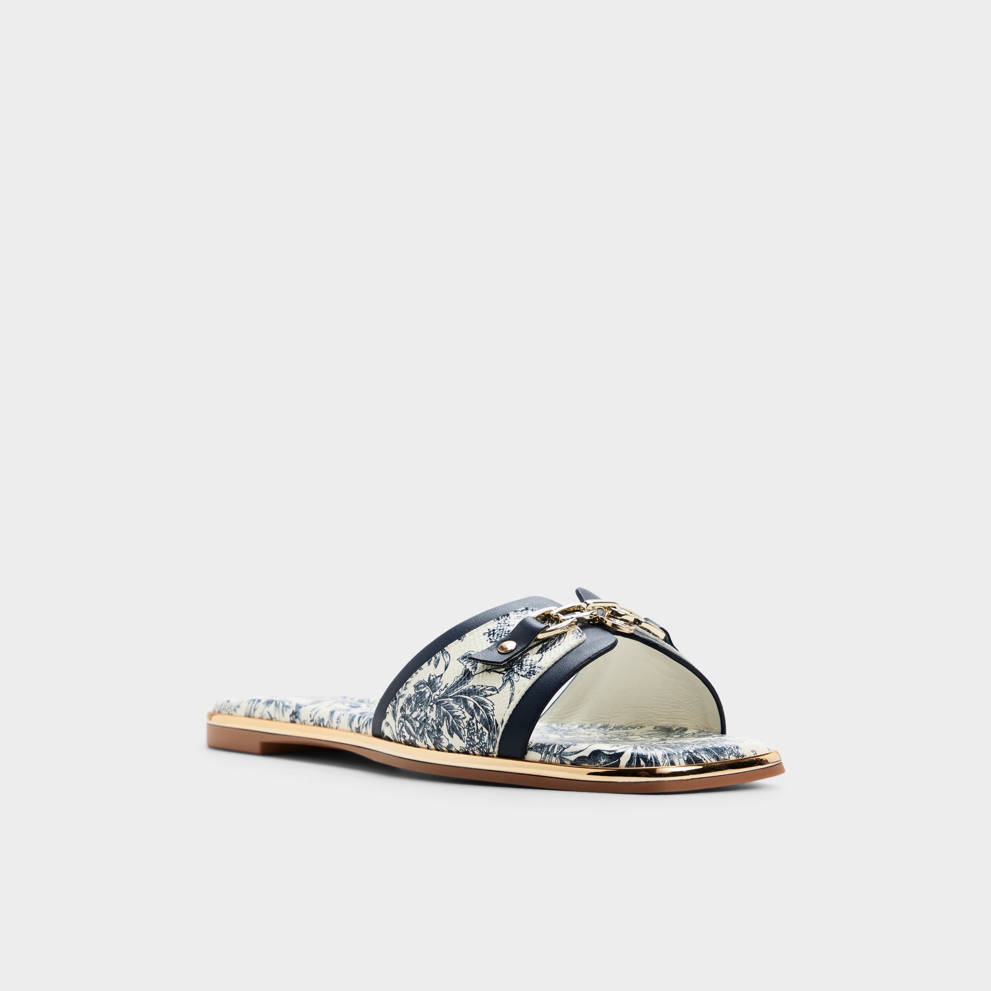 Three-quarter angle of White/blue Alamassi Slide sandal's front side