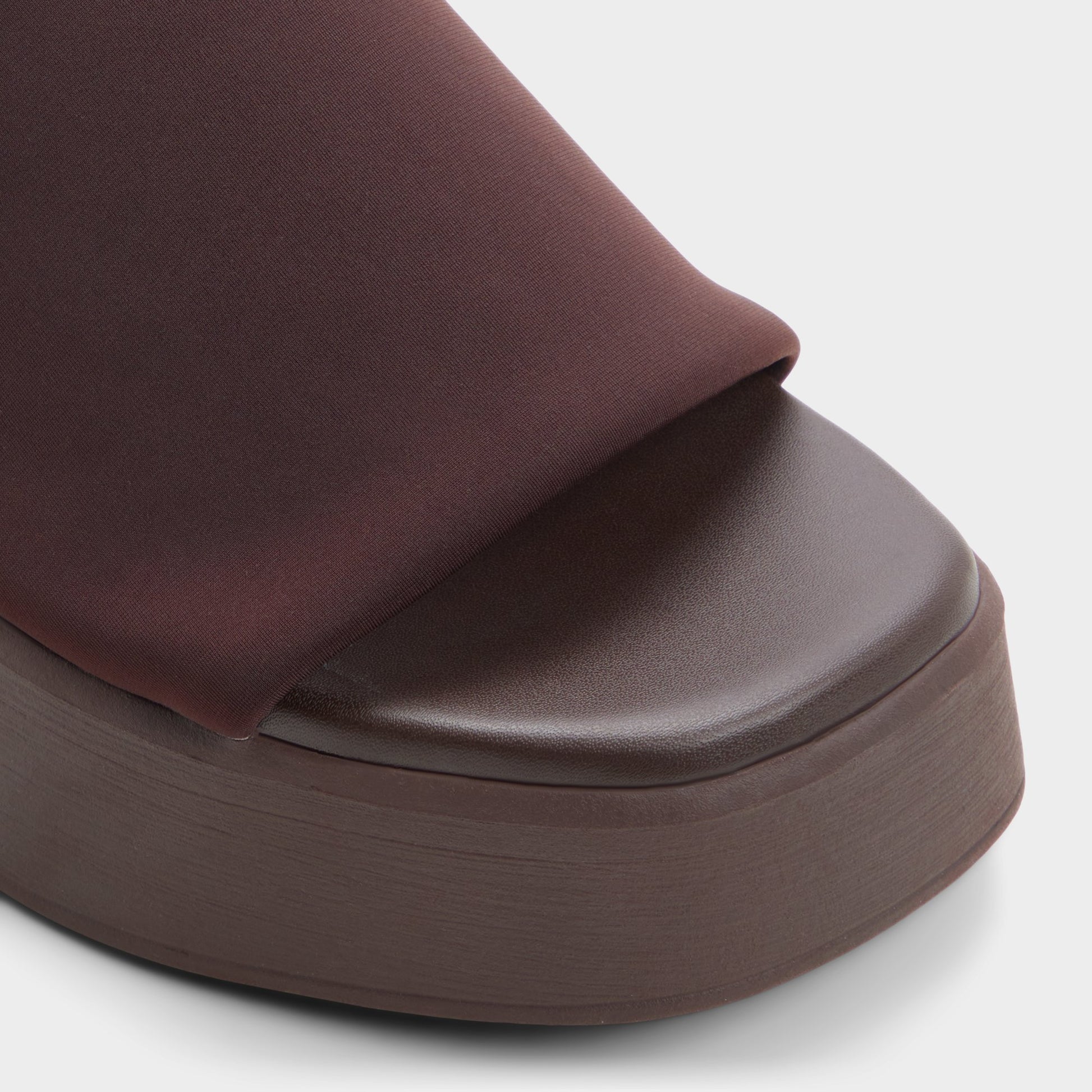 Close-up of the Dark brown Yassu Wedge sandal