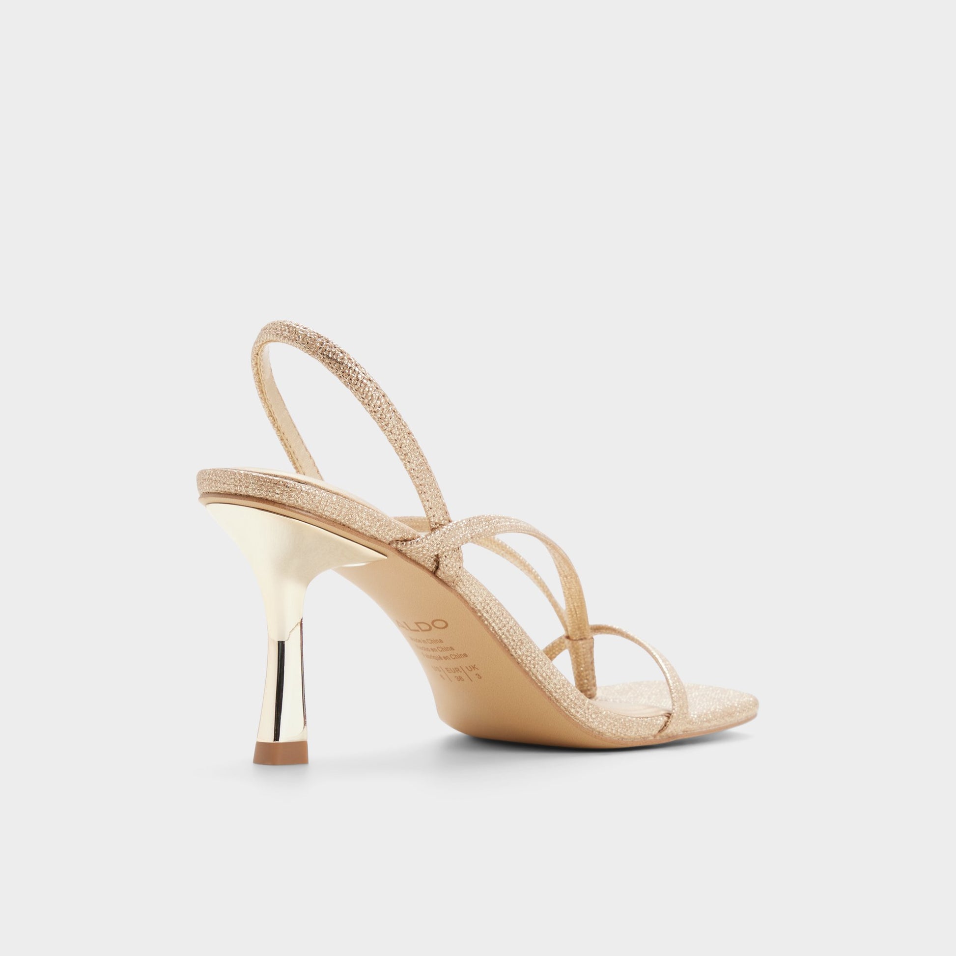 Three-quarter angle of Gold Riva Slingback heeled sandal's back side