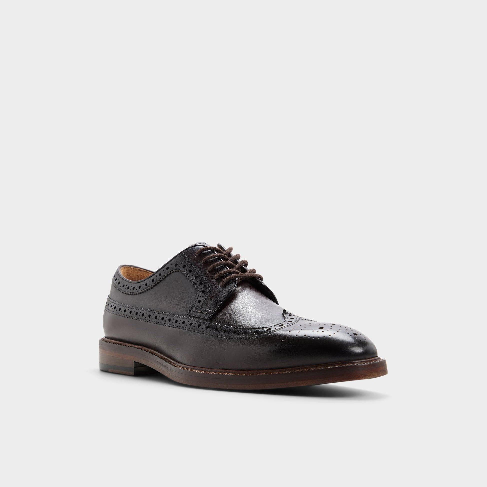 Three-quarter angle of Dark brown Ricio Brogue lace-up shoe's front side