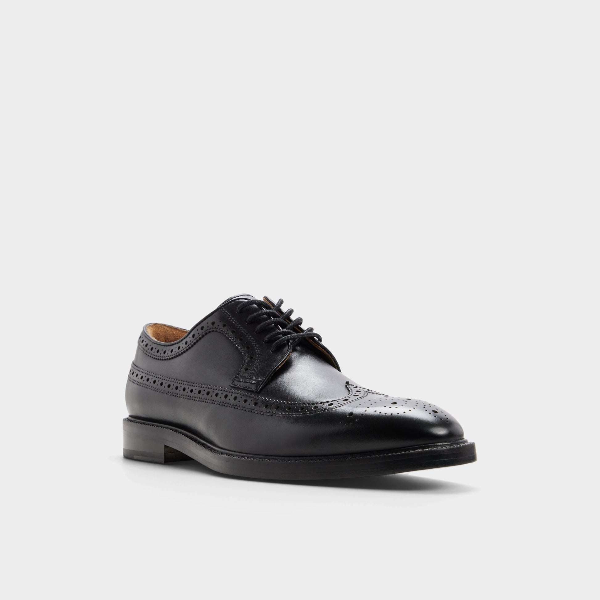 Three-quarter angle of Black Ricio Brogue lace-up shoe's front side