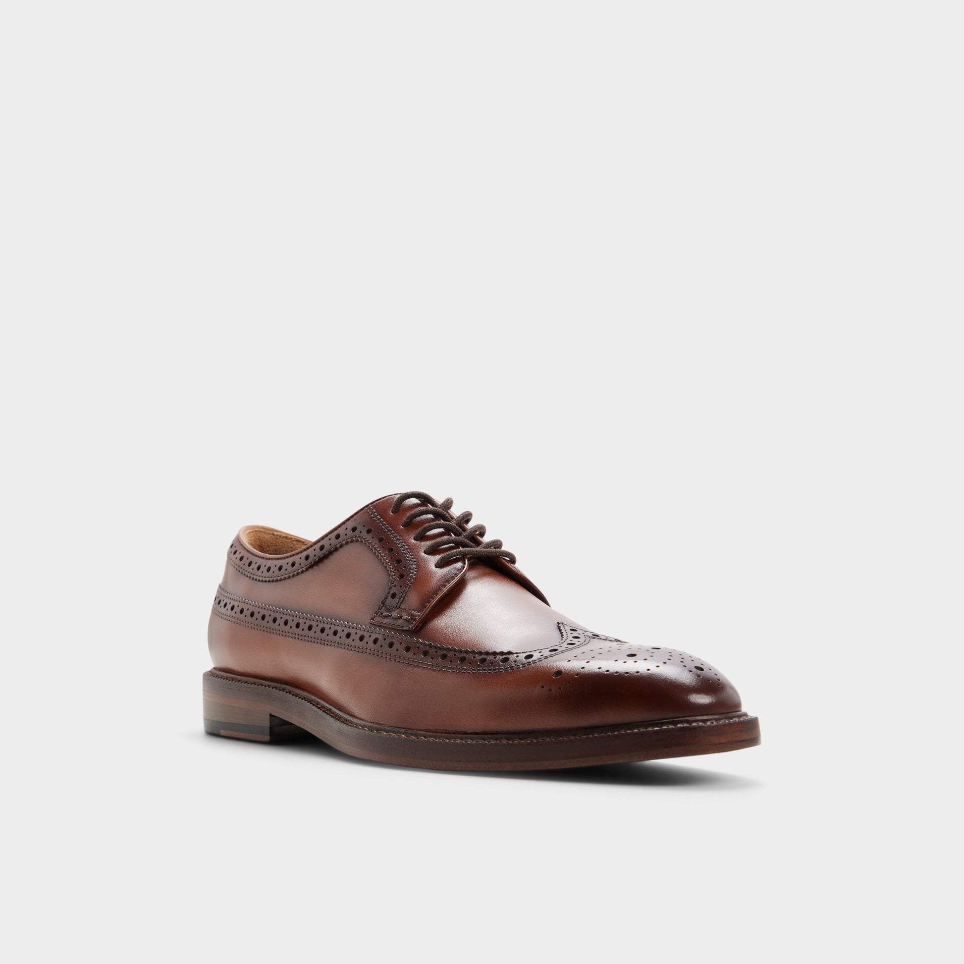 Three-quarter angle of Cognac Ricio Brogue lace-up shoe's front side