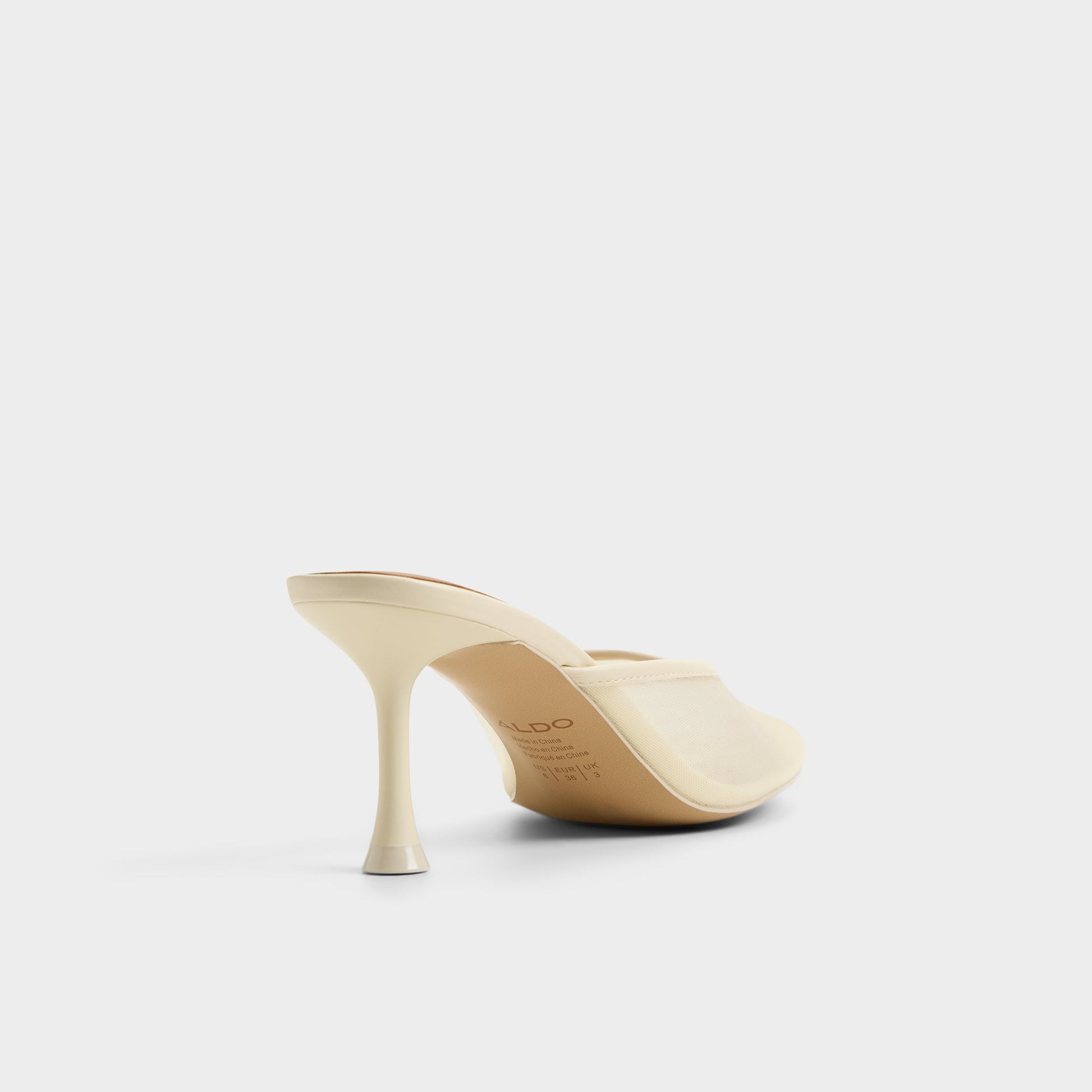 Three-quarter angle of Light yellow Cristelle Heeled mule's back side