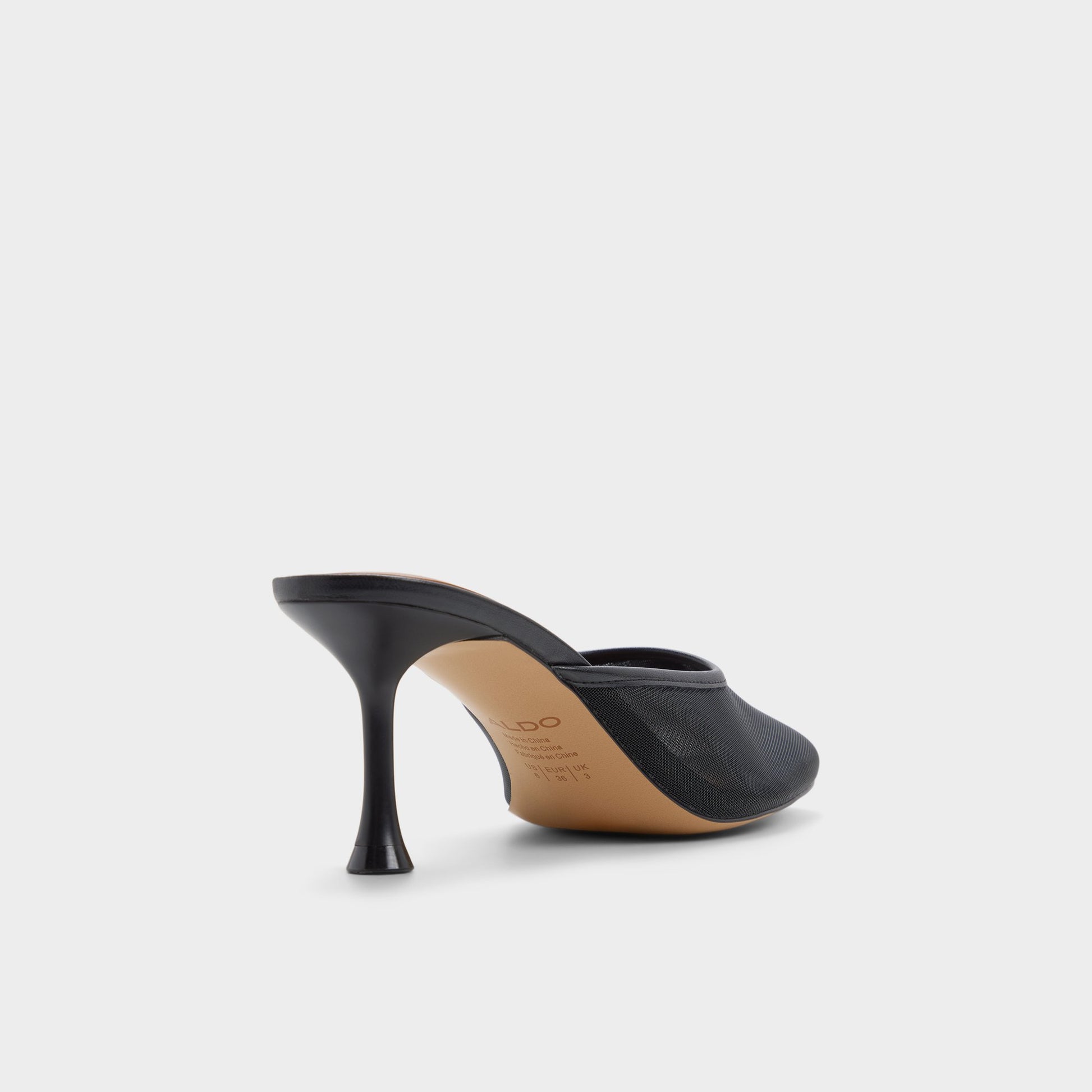 Three-quarter angle of Black Cristelle Heeled mule's back side