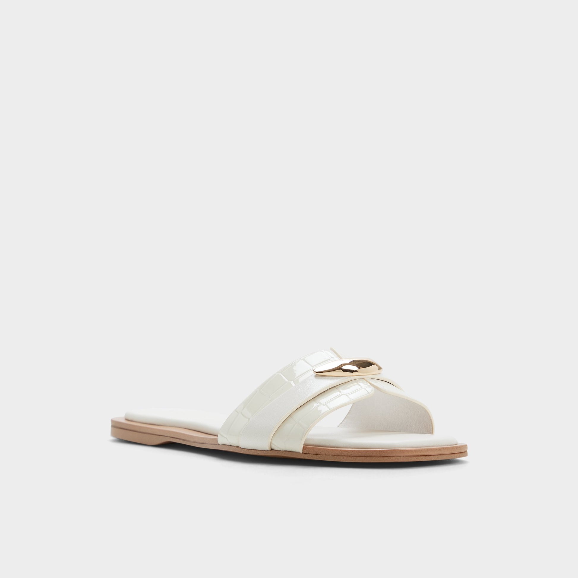 Three-quarter angle of White/bone Briela Slide sandal's front side