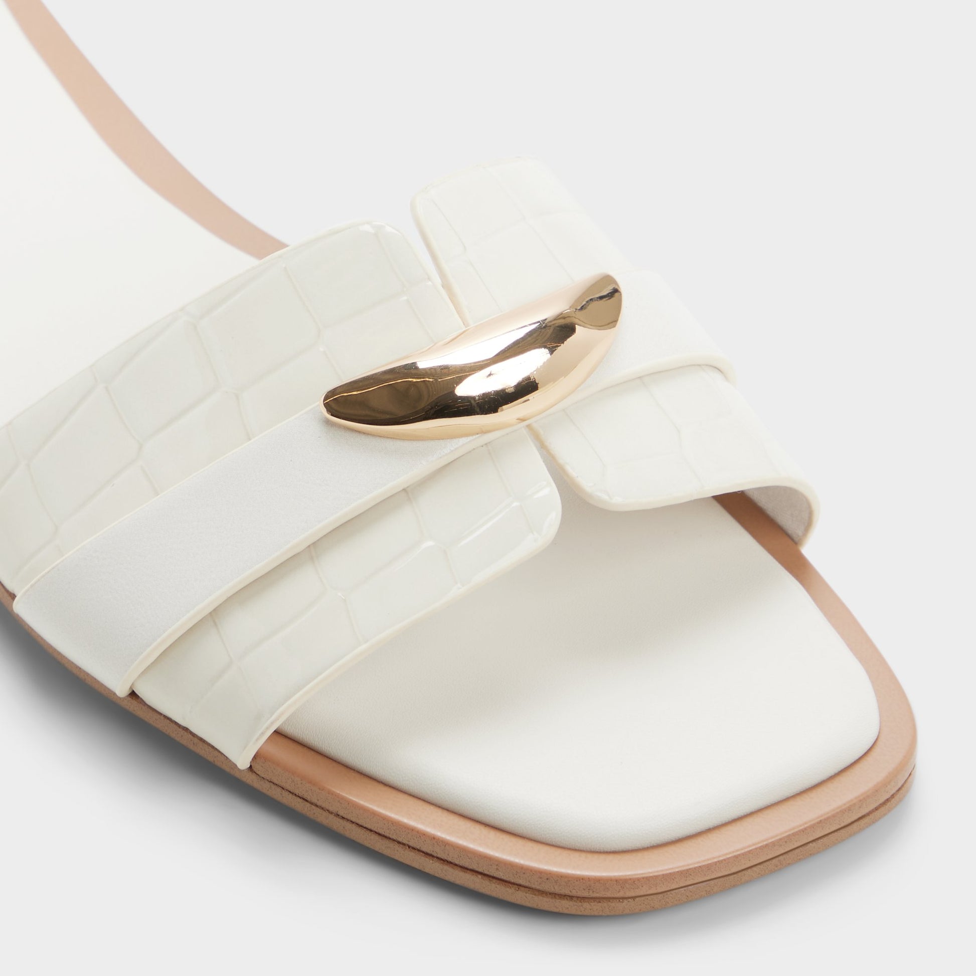 Close-up of the White/bone Briela Slide sandal