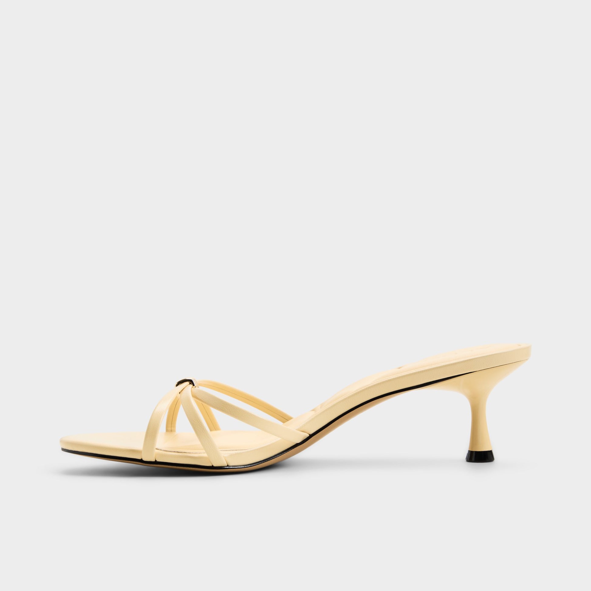Side view of Light yellow Madalyn Heeled mule