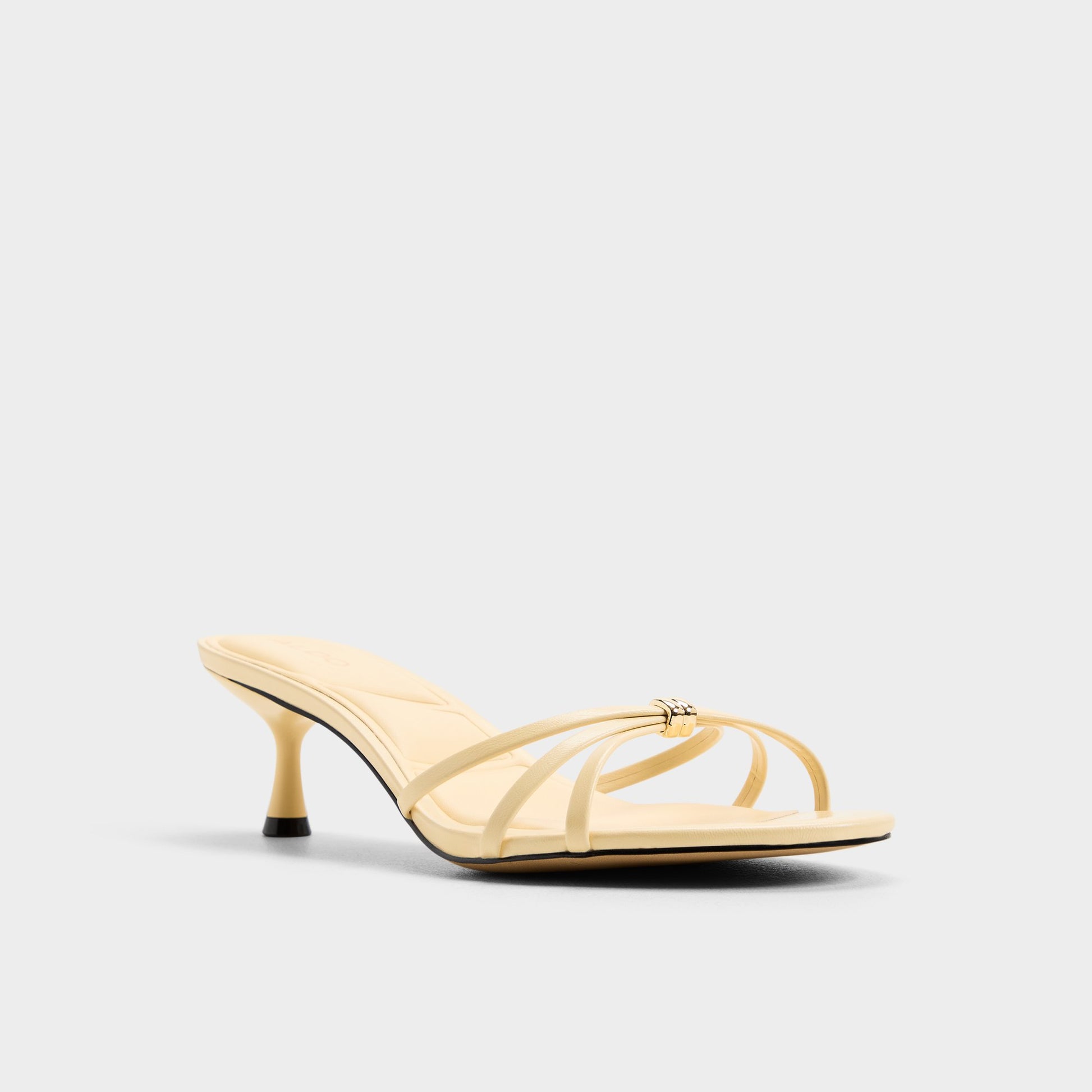 Three-quarter angle of Light yellow Madalyn Heeled mule's front side