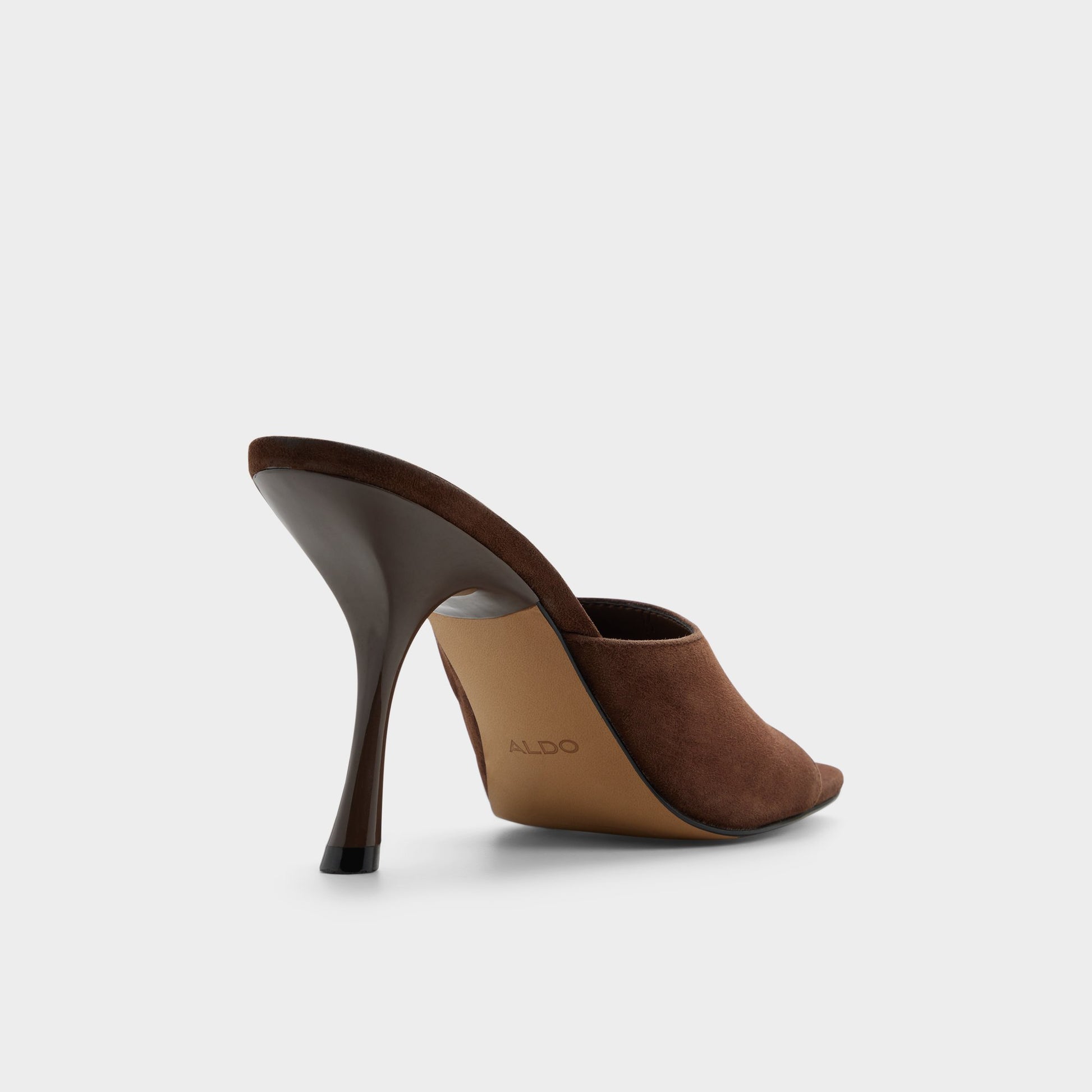 Three-quarter angle of Dark brown Comacan Heeled mule's back side