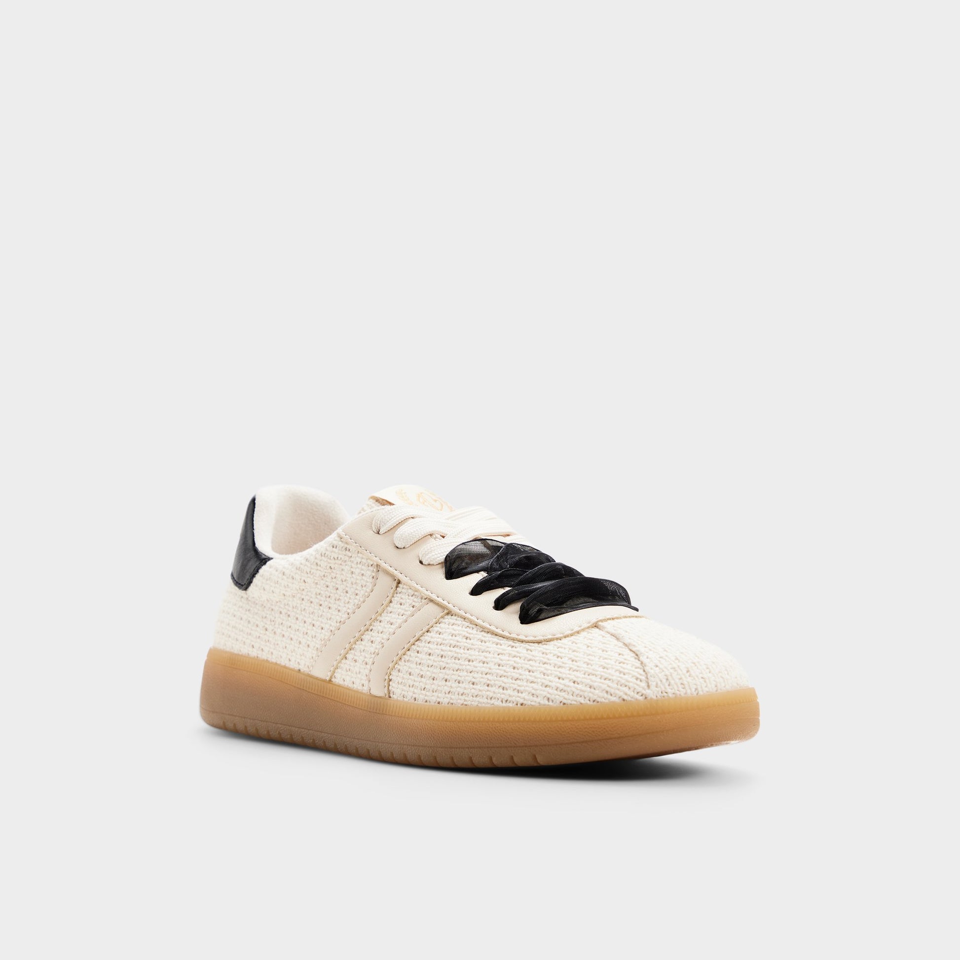 Three-quarter angle of Cream/blk Chicsneaker Sneaker's front side